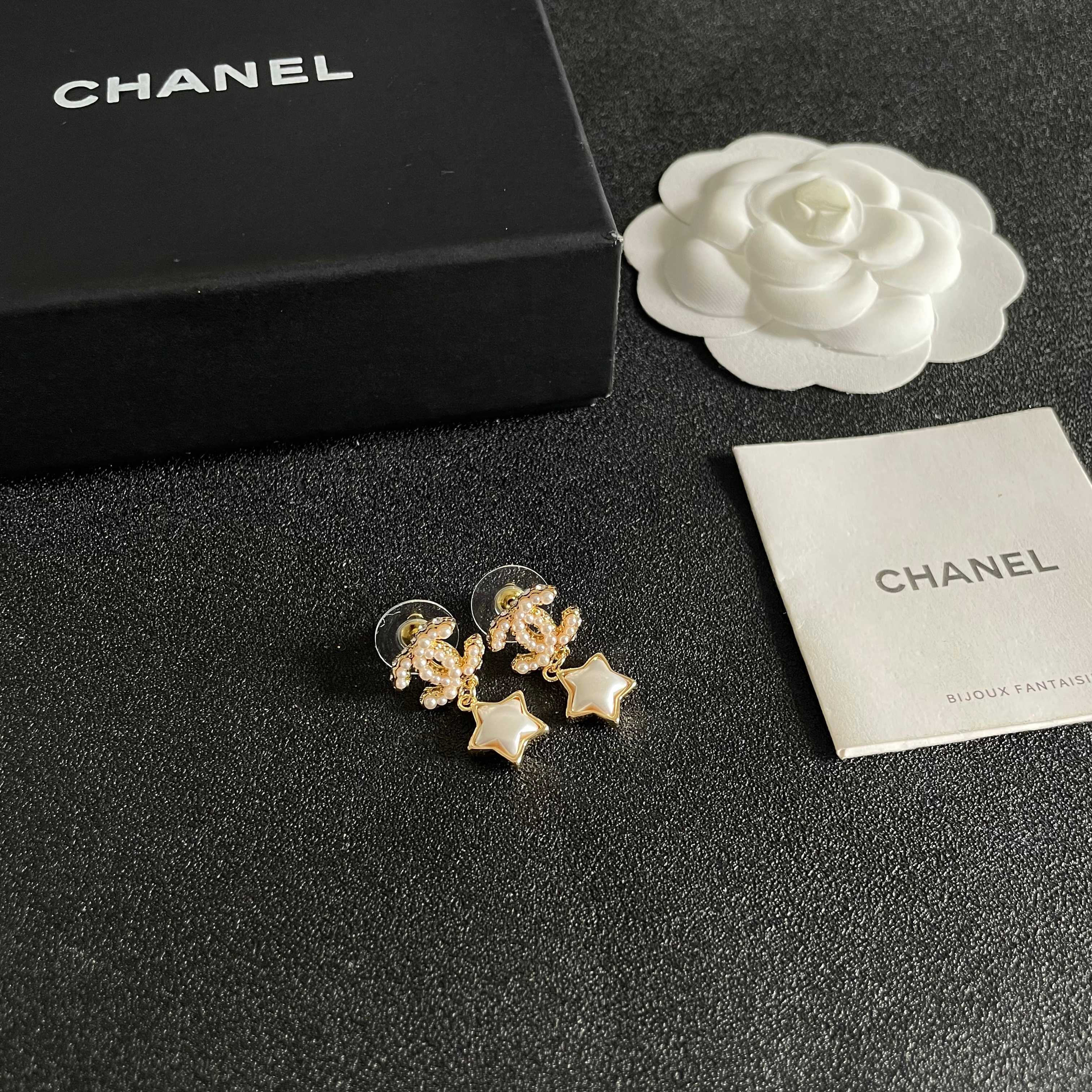 Chanel CC Star Drop Earrings earrings Gold-tone metal with cream pearl CC detailing and white mother-of-pearl star charms One Size drop length approx 2cm