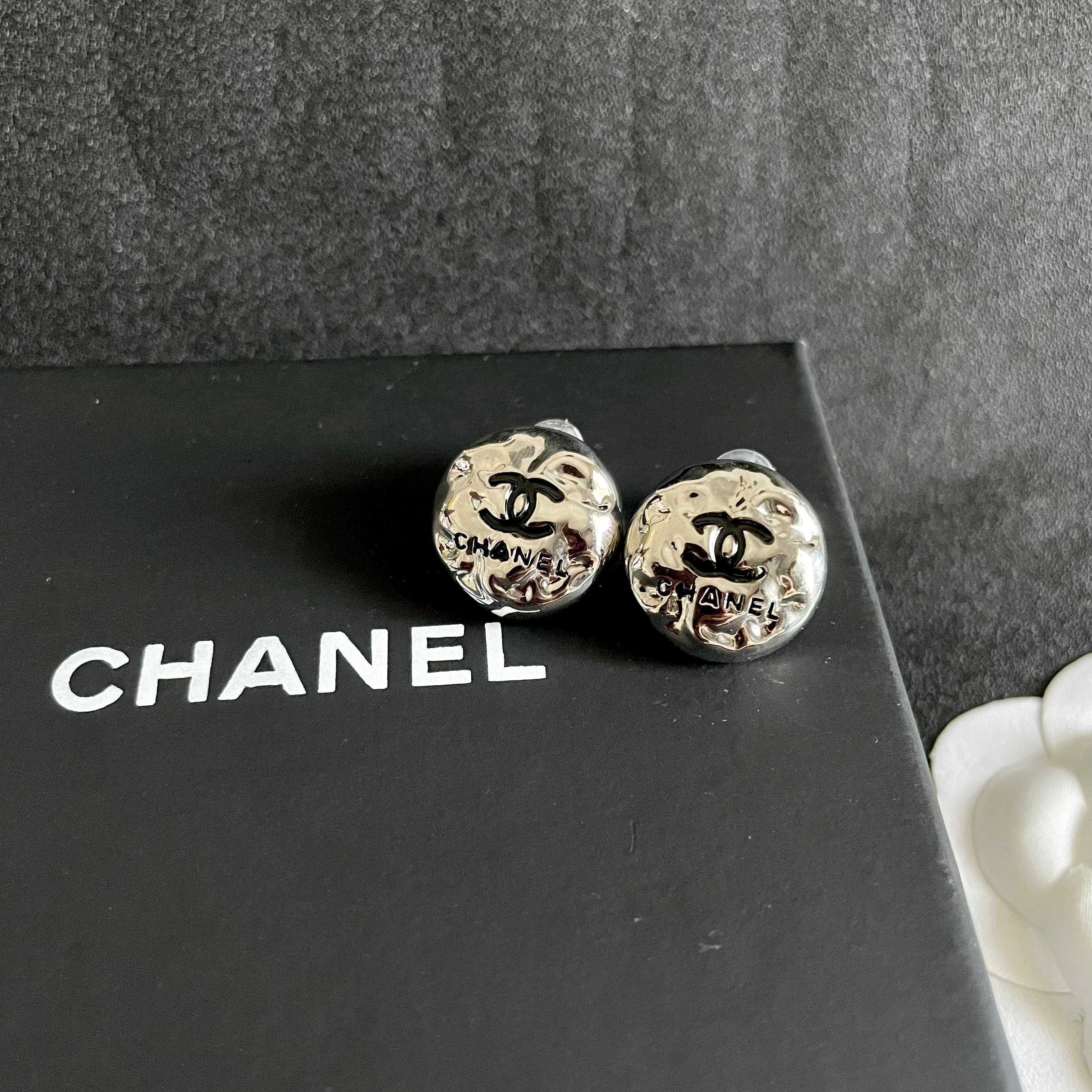 Chanel CC Logo Hammered Dome Stud Earrings earrings Silver-tone metal with black enamel CC logo detailing 1 5cm diameter