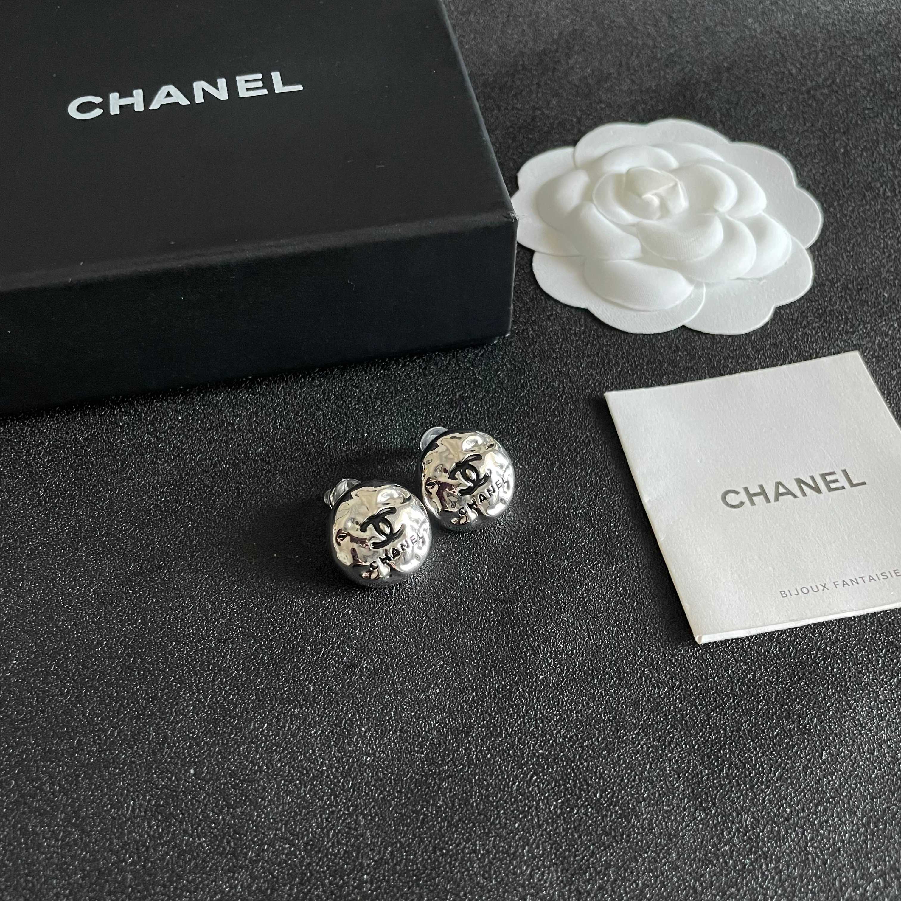Chanel CC Logo Hammered Dome Stud Earrings earrings Silver-tone metal with black enamel CC logo detailing 1 5cm diameter