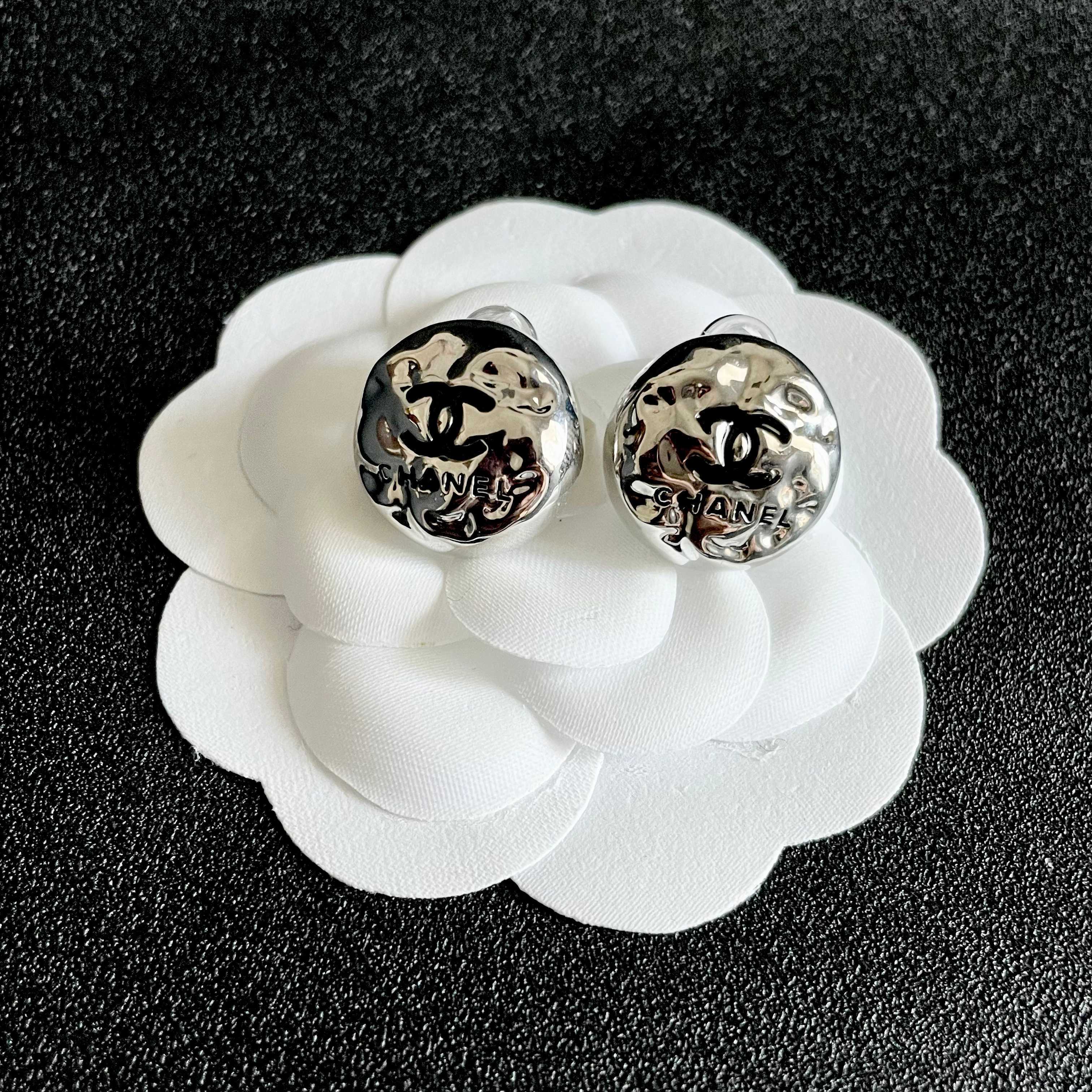 Chanel CC Logo Hammered Dome Stud Earrings earrings Silver-tone metal with black enamel CC logo detailing 1 5cm diameter