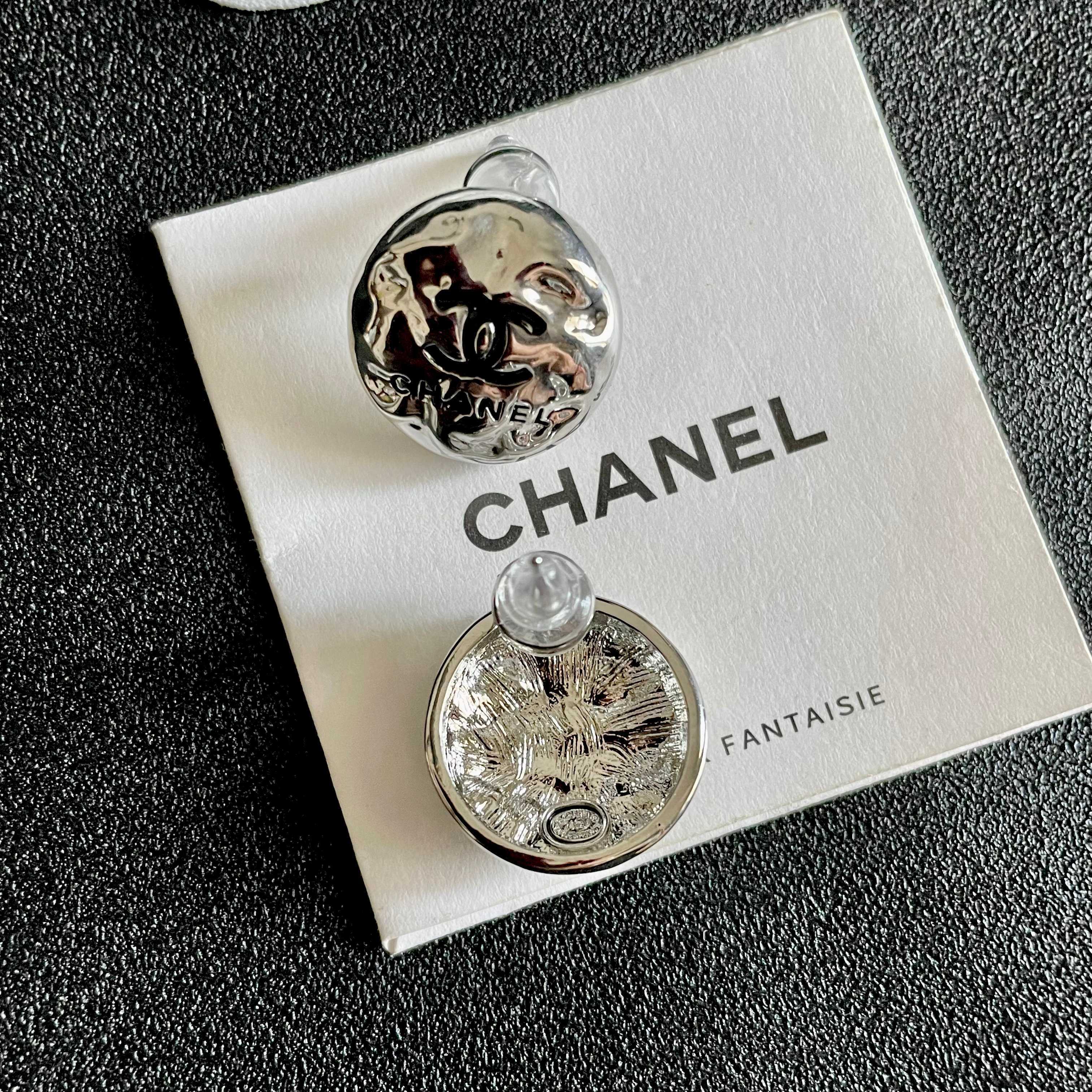 Chanel CC Logo Hammered Dome Stud Earrings earrings Silver-tone metal with black enamel CC logo detailing 1 5cm diameter