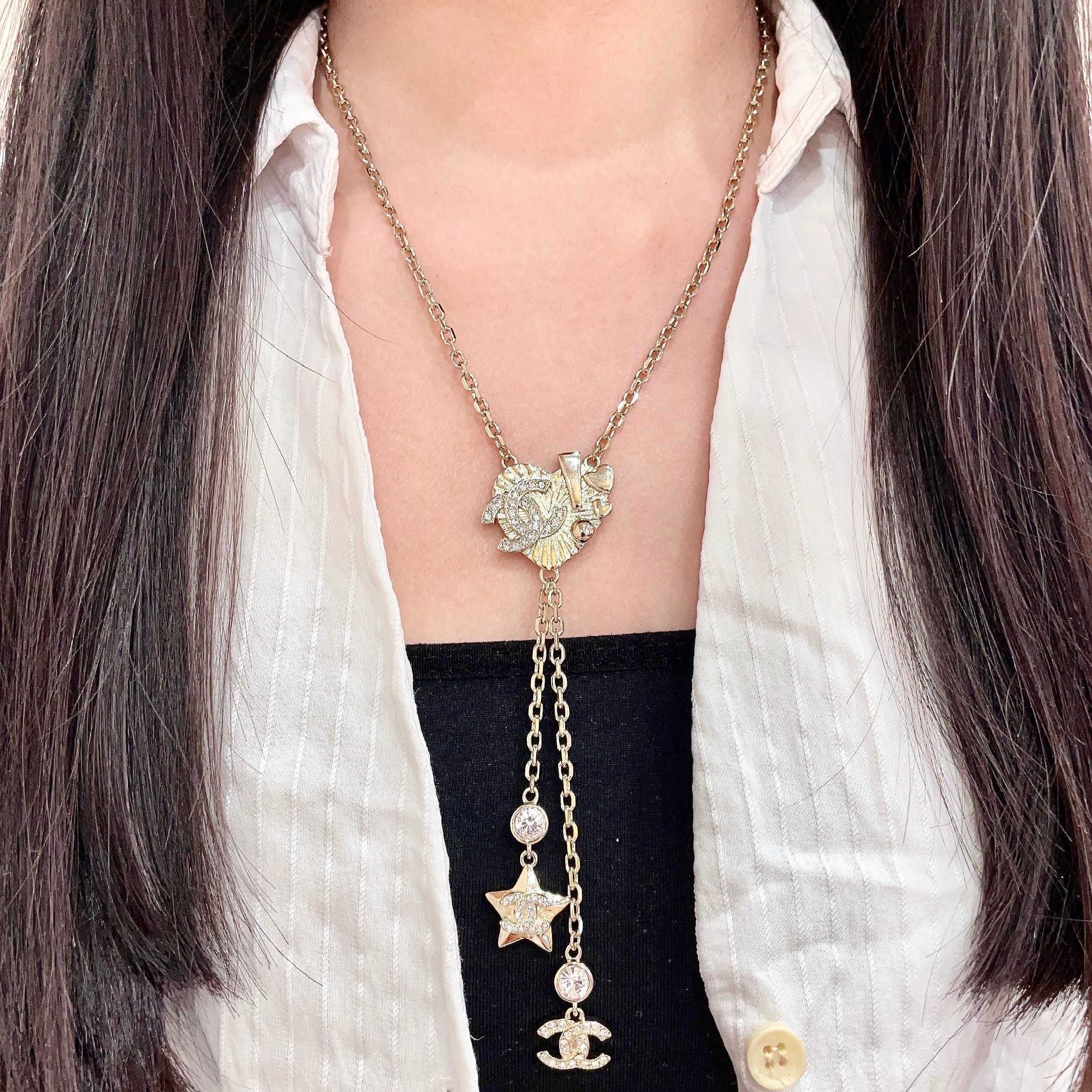 Chanel CC Heart Star Lariat necklace light gold metal with clear crystal accents 42cm
