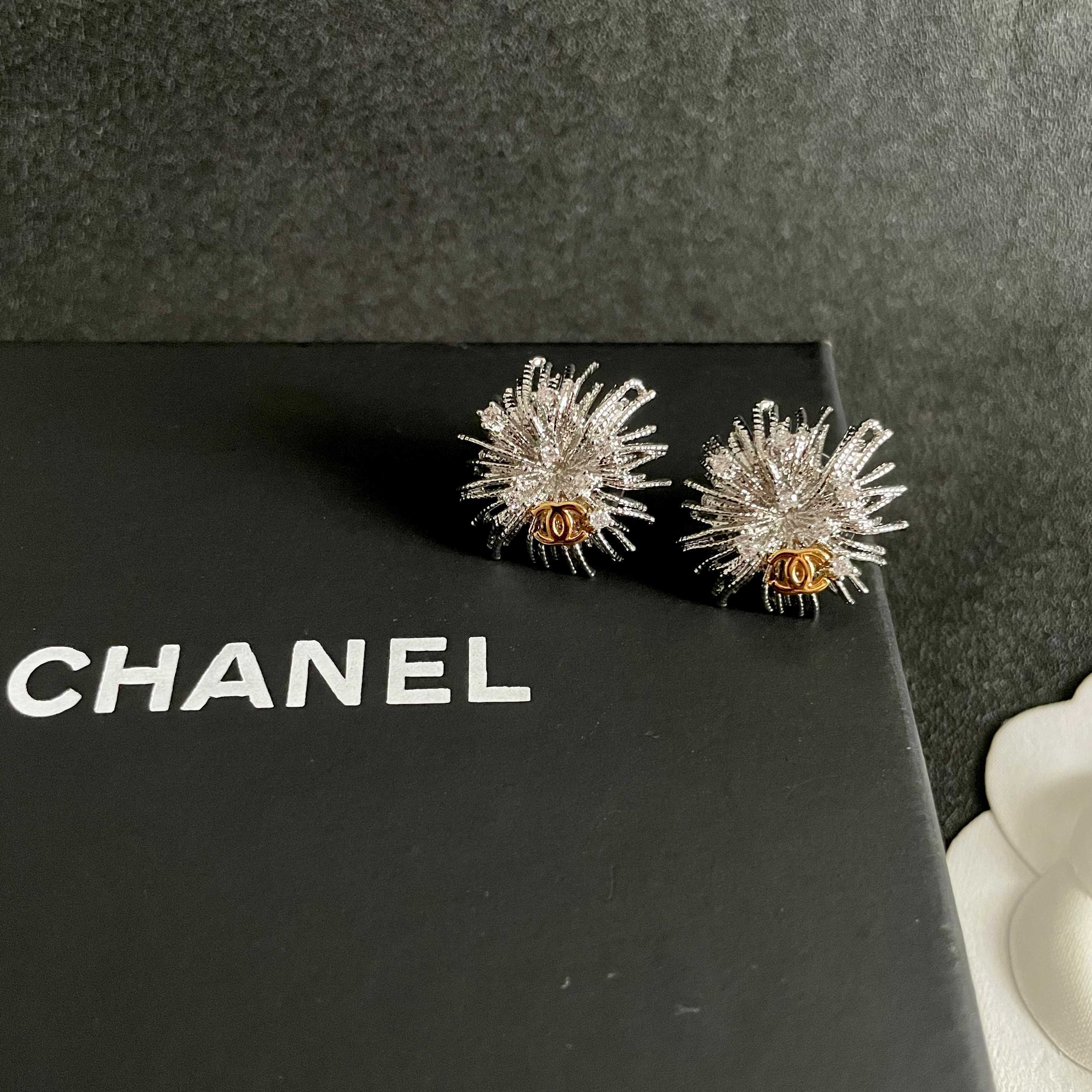 Chanel CC Sunburst Stud Earrings earrings silver-tone metal with clear crystal accents and gold-tone CC logo 1 5cm diameter