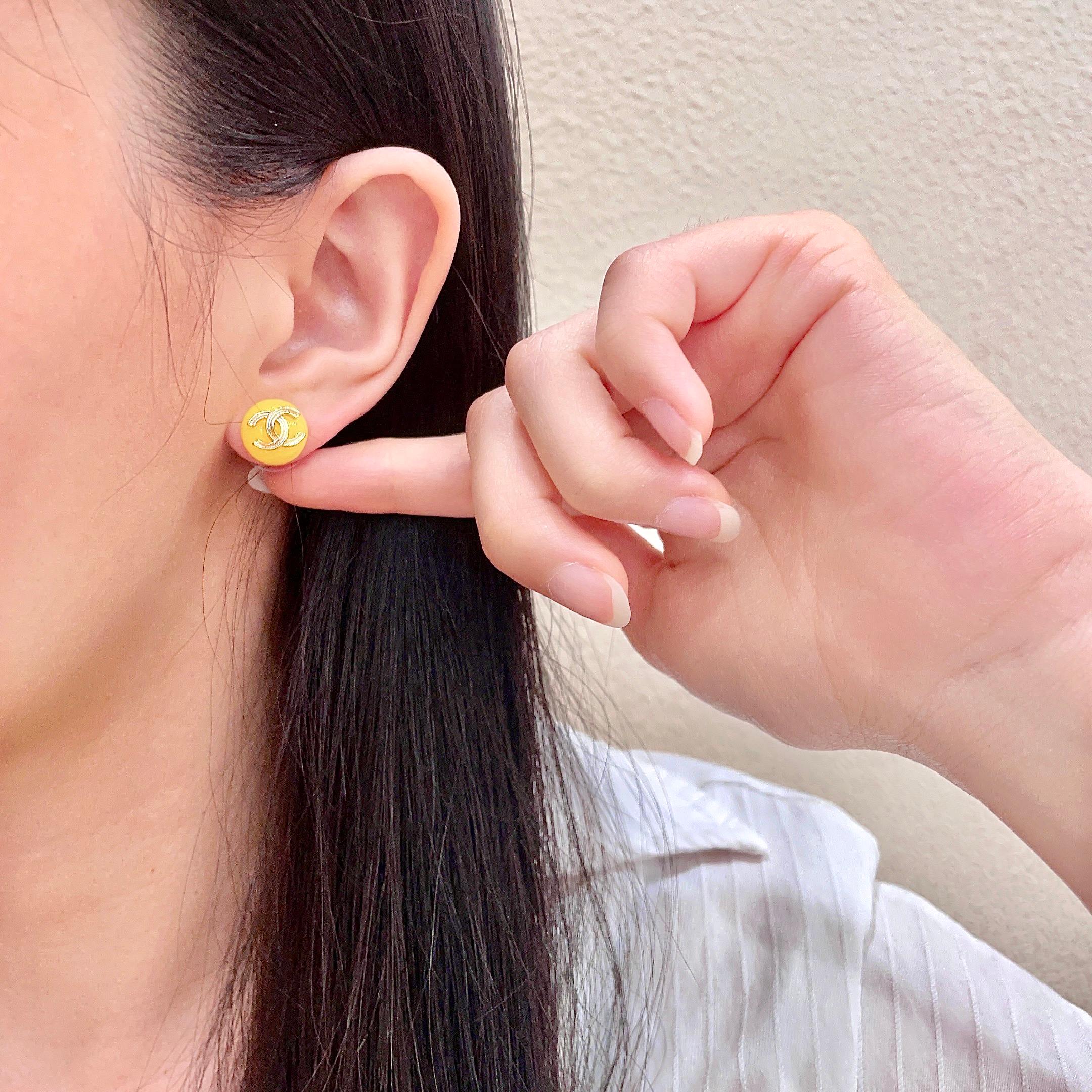Chanel CC Logo Round Stud Earrings earrings gold-tone metal bright yellow resin 10mm diameter