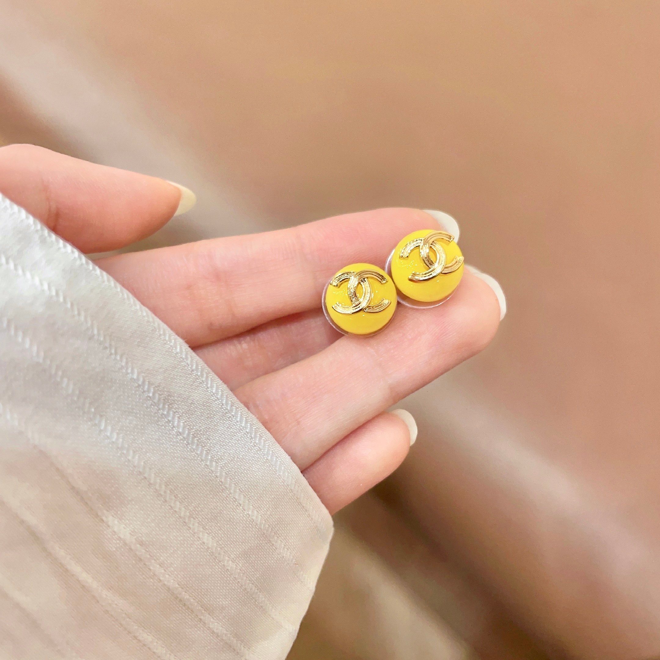 Chanel CC Logo Round Stud Earrings earrings gold-tone metal bright yellow resin 10mm diameter