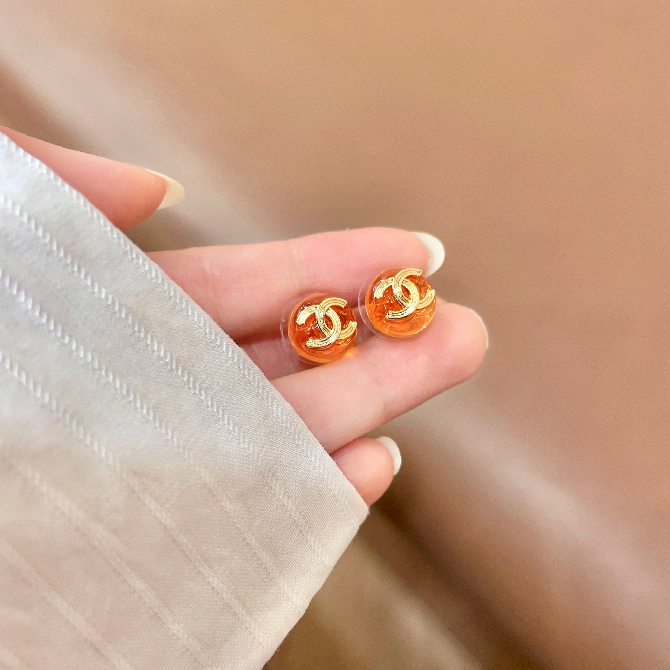 Chanel CC Logo Round Stud Earrings earrings gold-tone metal translucent orange resin 1 2cm diameter