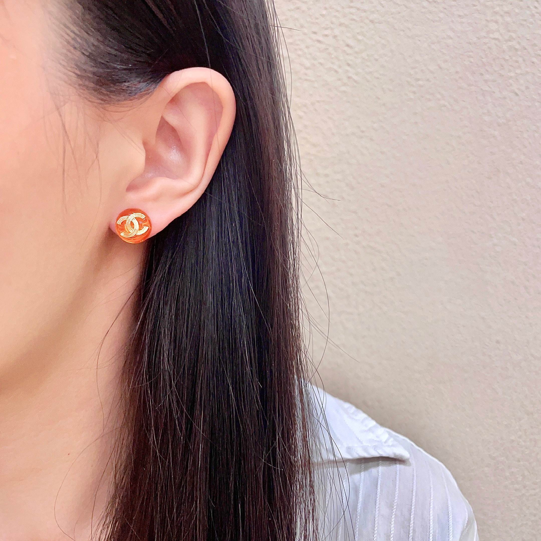 Chanel CC Logo Round Stud Earrings earrings gold-tone metal translucent orange resin 1 2cm diameter
