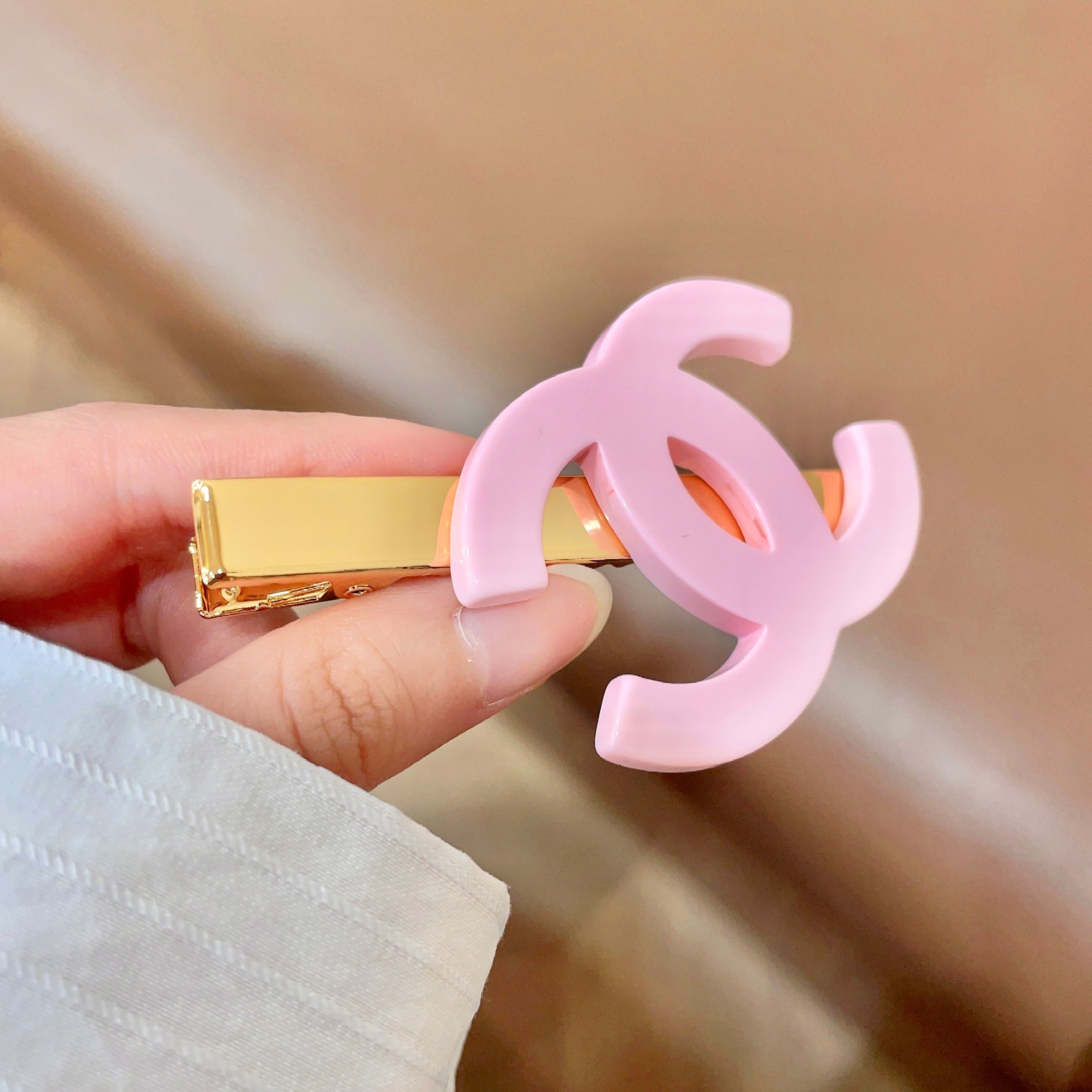 Chanel CC Logo Hair Clip brooch Gold-tone metal with light pink resin CC logo 6cm