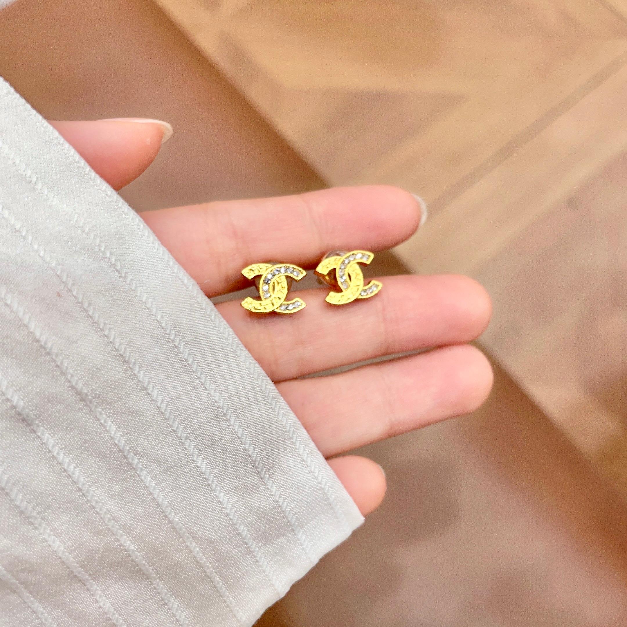 Chanel CC Logo Stud Earrings earrings Gold-tone metal with clear crystal accents silver-tone metal with clear crystal accents 1cm stud diameter