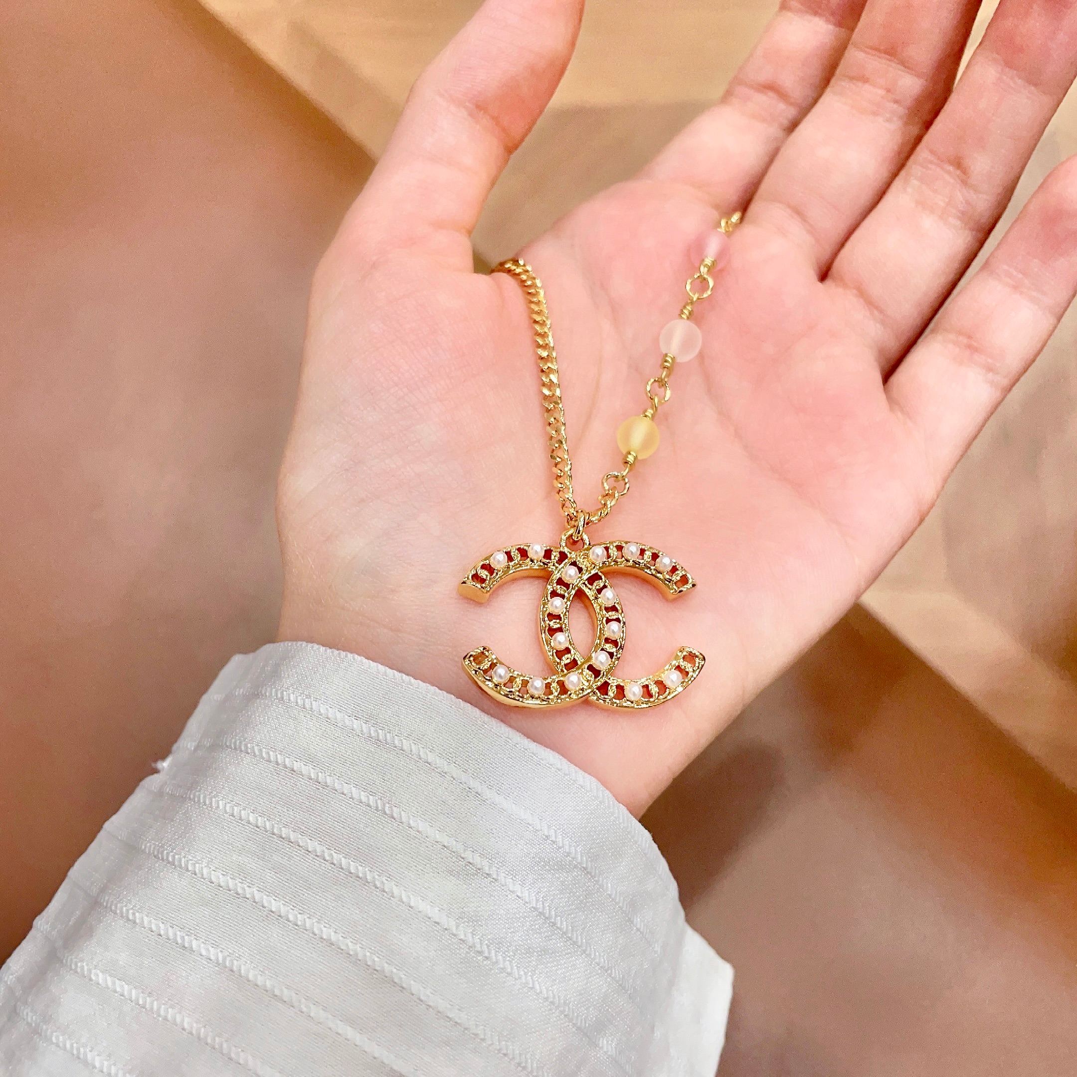 Chanel CC Logo Pastel Bead Pearl Necklace necklace Gold-tone metal with white faux pearls pastel pink frosted clear and pale yellow accent beads 42cm