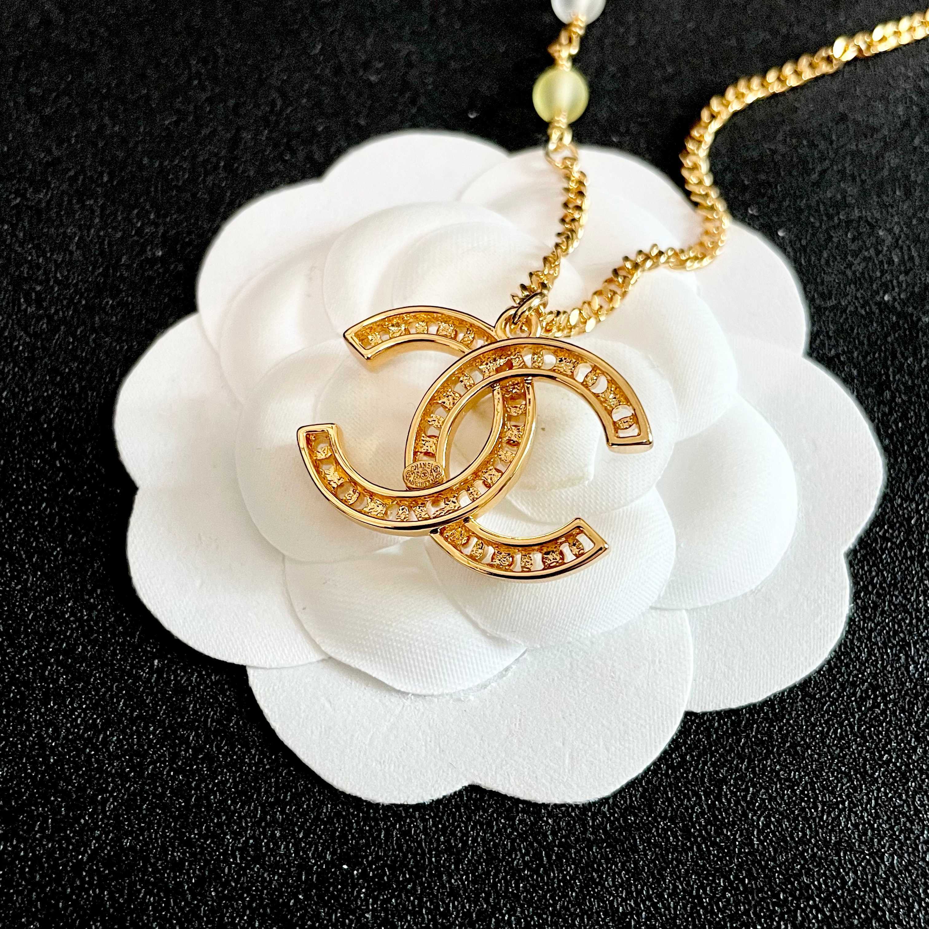 Chanel CC Logo Pastel Bead Pearl Necklace necklace Gold-tone metal with white faux pearls pastel pink frosted clear and pale yellow accent beads 42cm