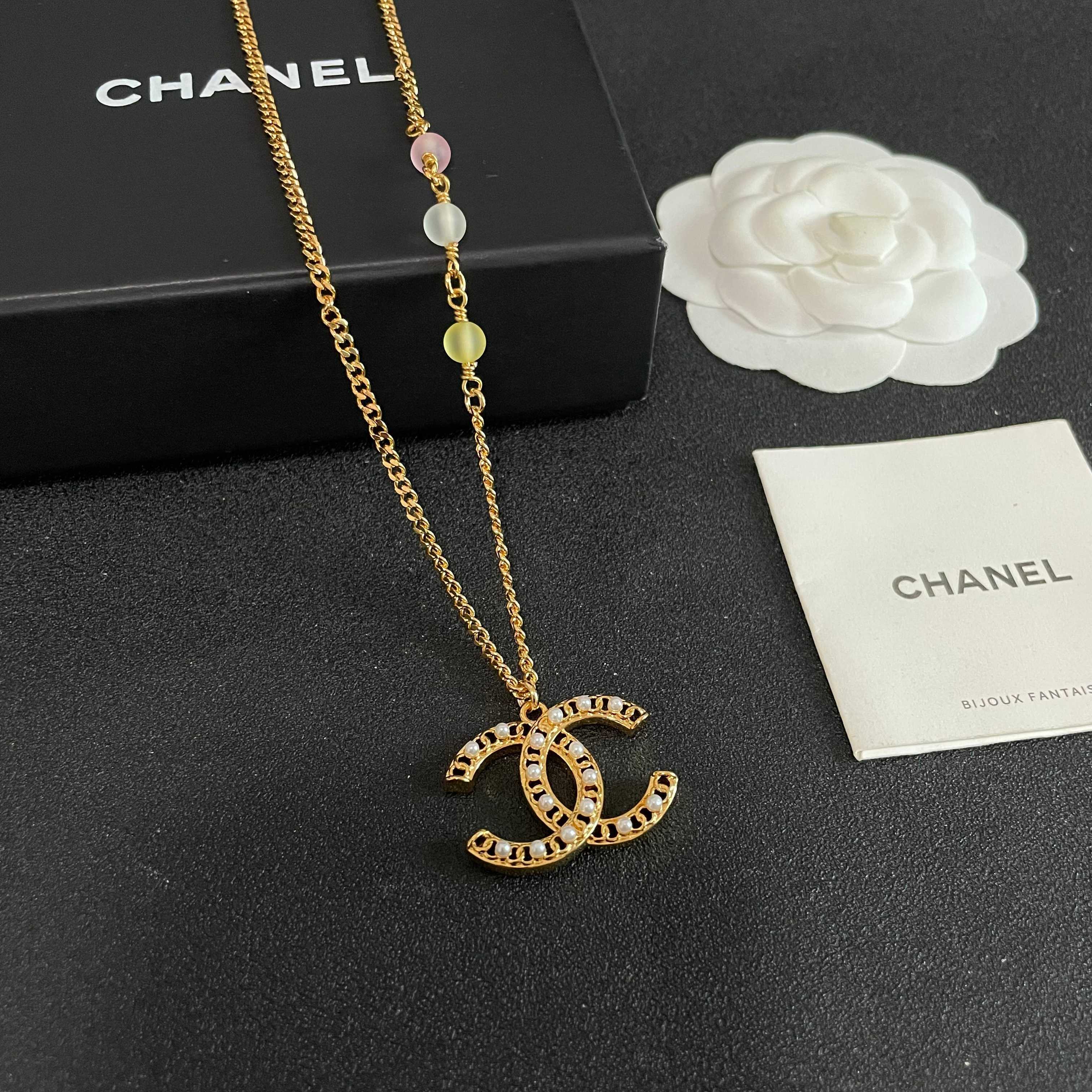 Chanel CC Logo Pastel Bead Pearl Necklace necklace Gold-tone metal with white faux pearls pastel pink frosted clear and pale yellow accent beads 42cm