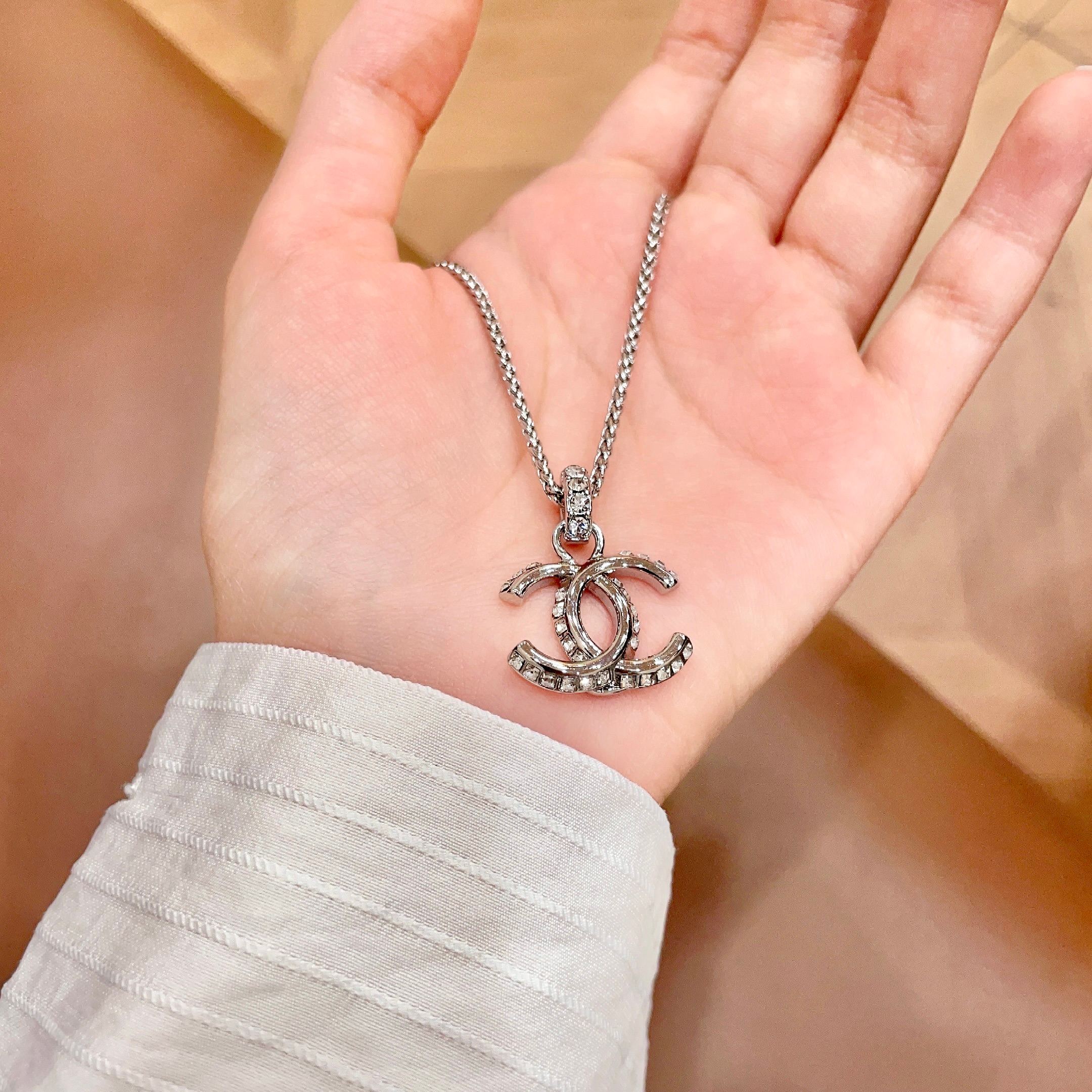 Chanel CC Logo Pendant Necklace necklace Silver-toned metal with clear crystal accents 42cm