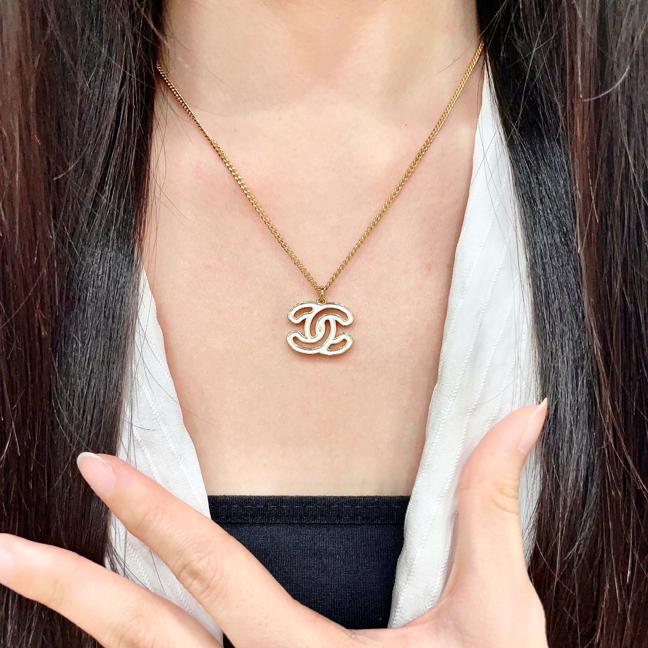 Chanel CC Logo Pendant Necklace necklace Gold-tone metal with white enamel fill 42cm