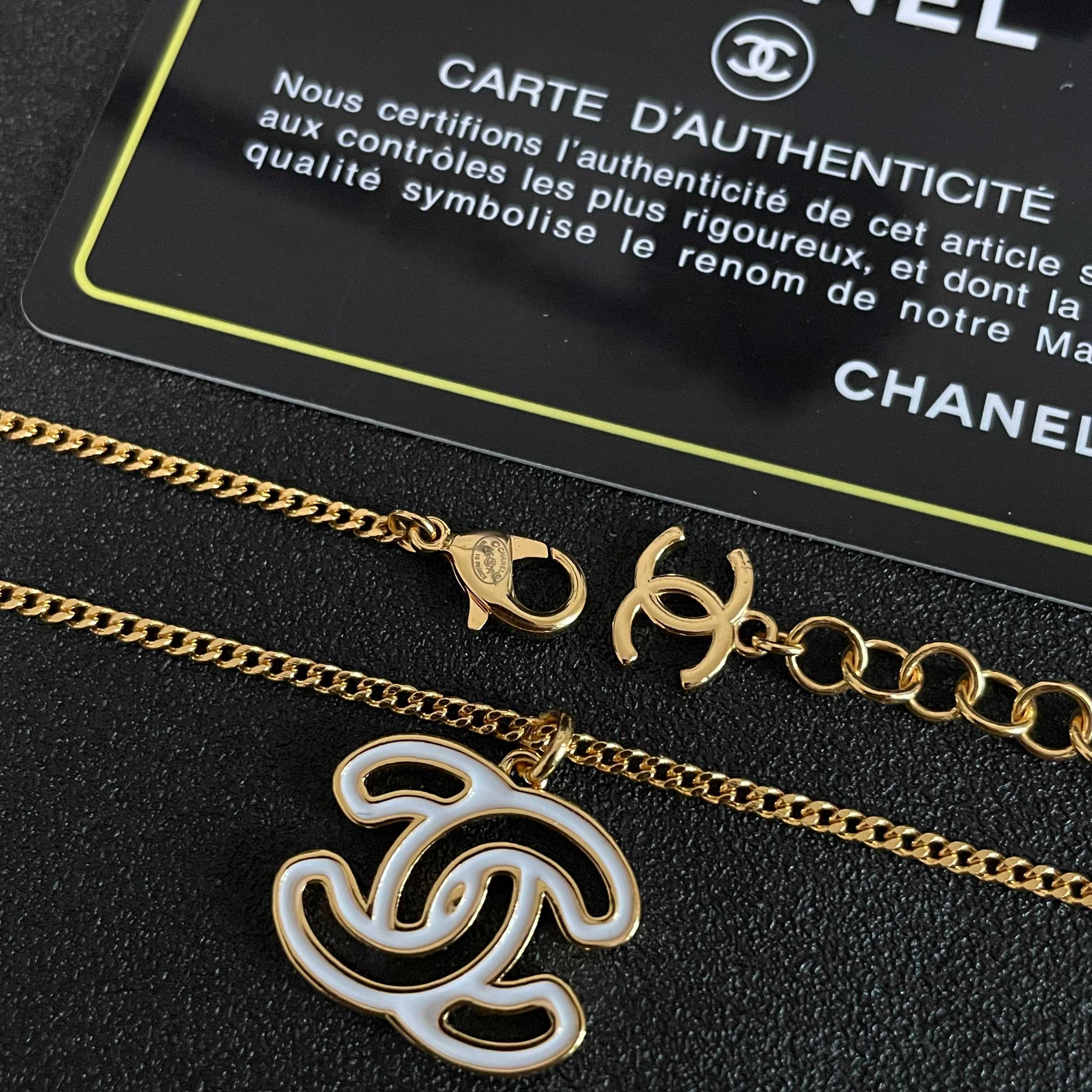 Chanel CC Logo Pendant Necklace necklace Gold-tone metal with white enamel fill 42cm