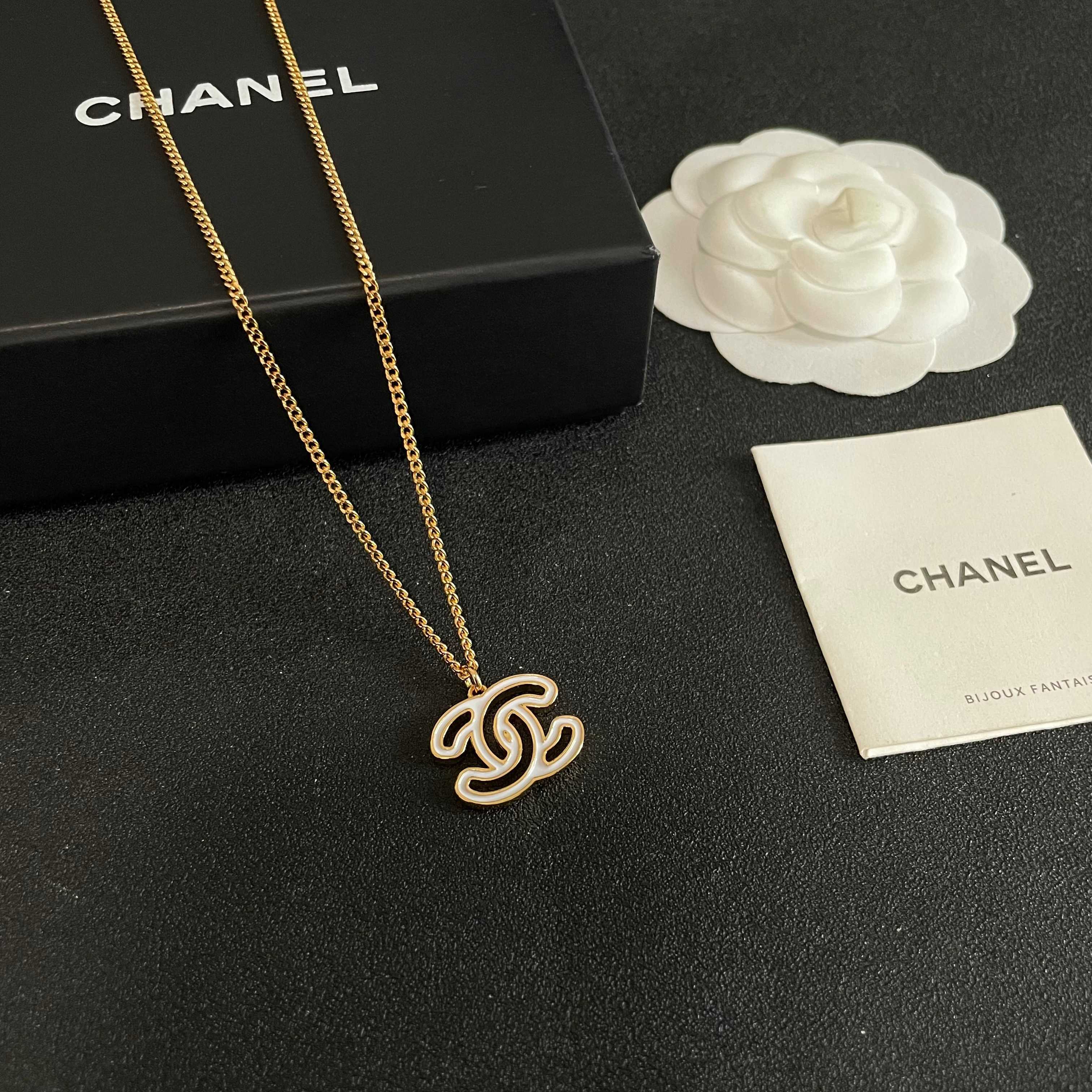 Chanel CC Logo Pendant Necklace necklace Gold-tone metal with white enamel fill 42cm