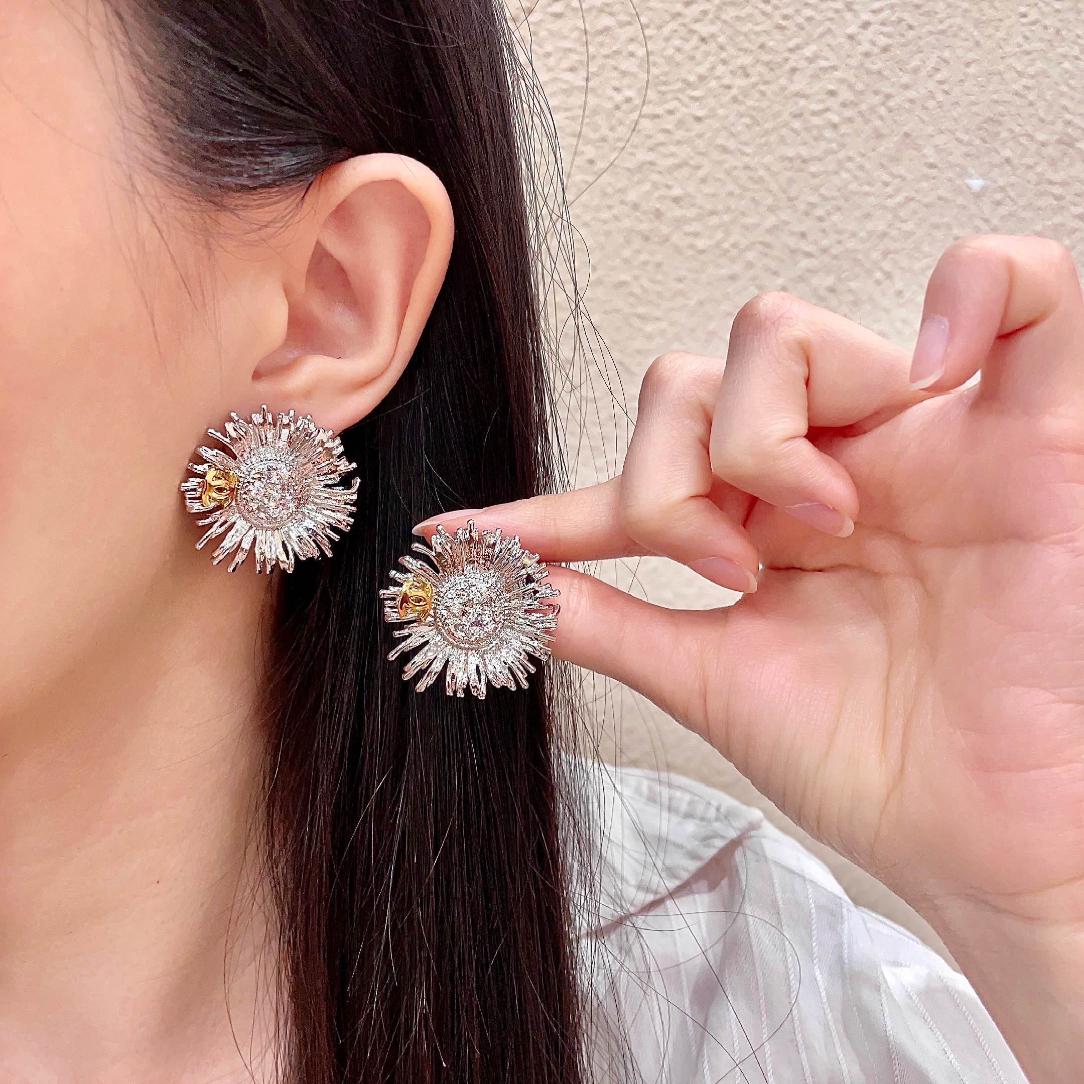 Chanel Sunburst CC Stud Earrings earrings Two-tone gold and silver metal with clear crystal accents 2 5cm diameter