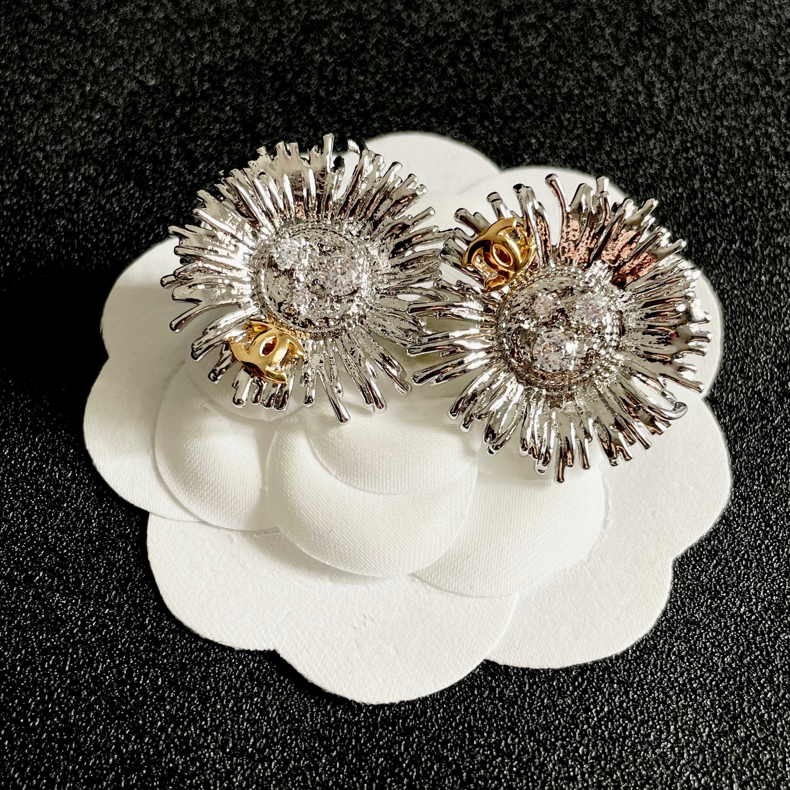 Chanel Sunburst CC Stud Earrings earrings Two-tone gold and silver metal with clear crystal accents 2 5cm diameter