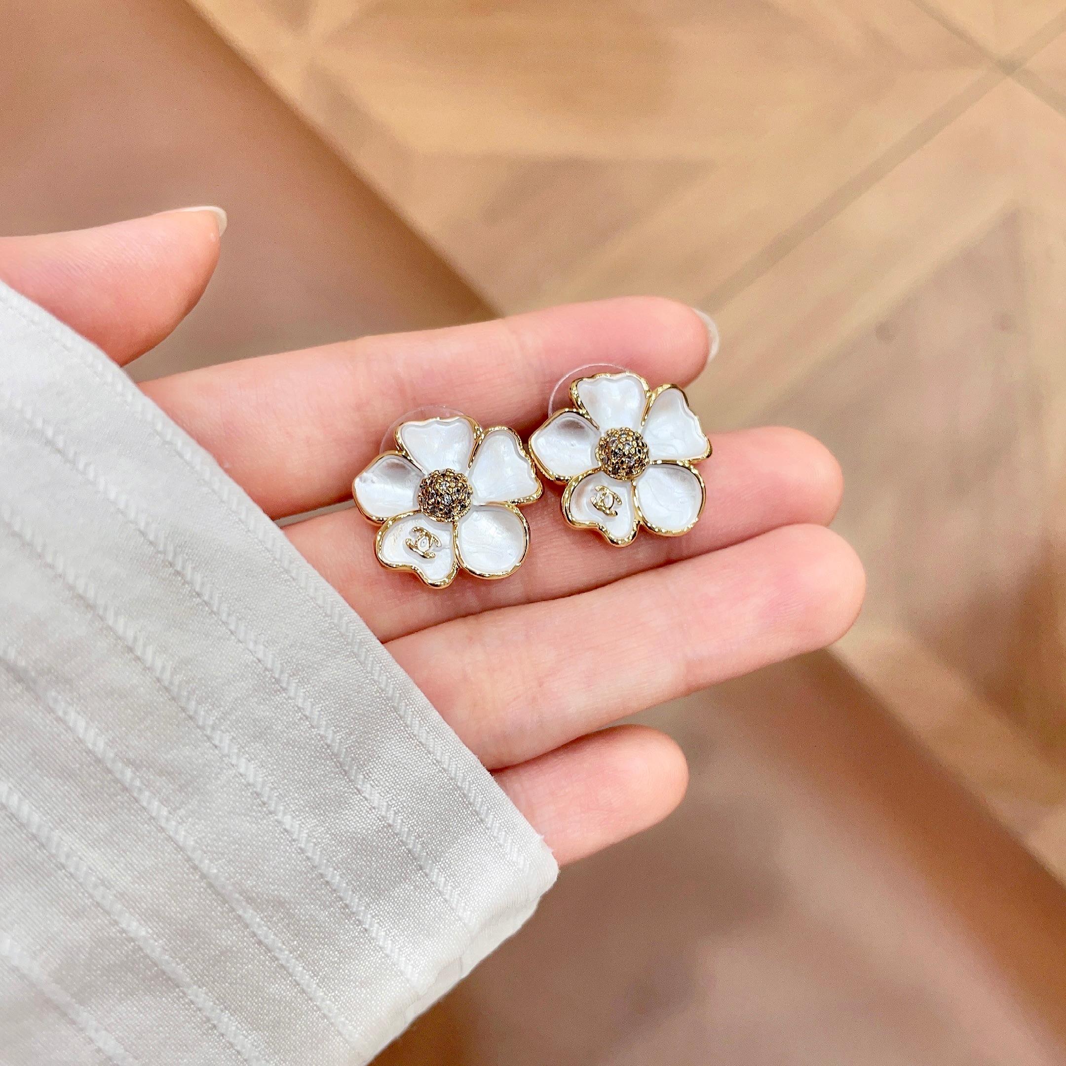 Chanel CC Camellia Flower Stud Earrings earrings Gold-tone metal white mother-of-pearl effect petals clear crystal accents 1 5cm diameter
