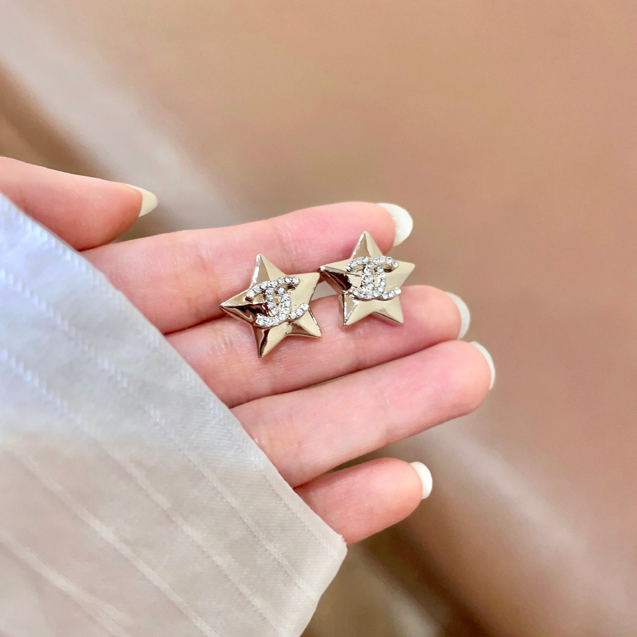 Chanel CC Star Stud Earrings earrings Gold-tone metal with clear crystal accents silver-tone metal with clear crystal accents 1 5cm stud diameter