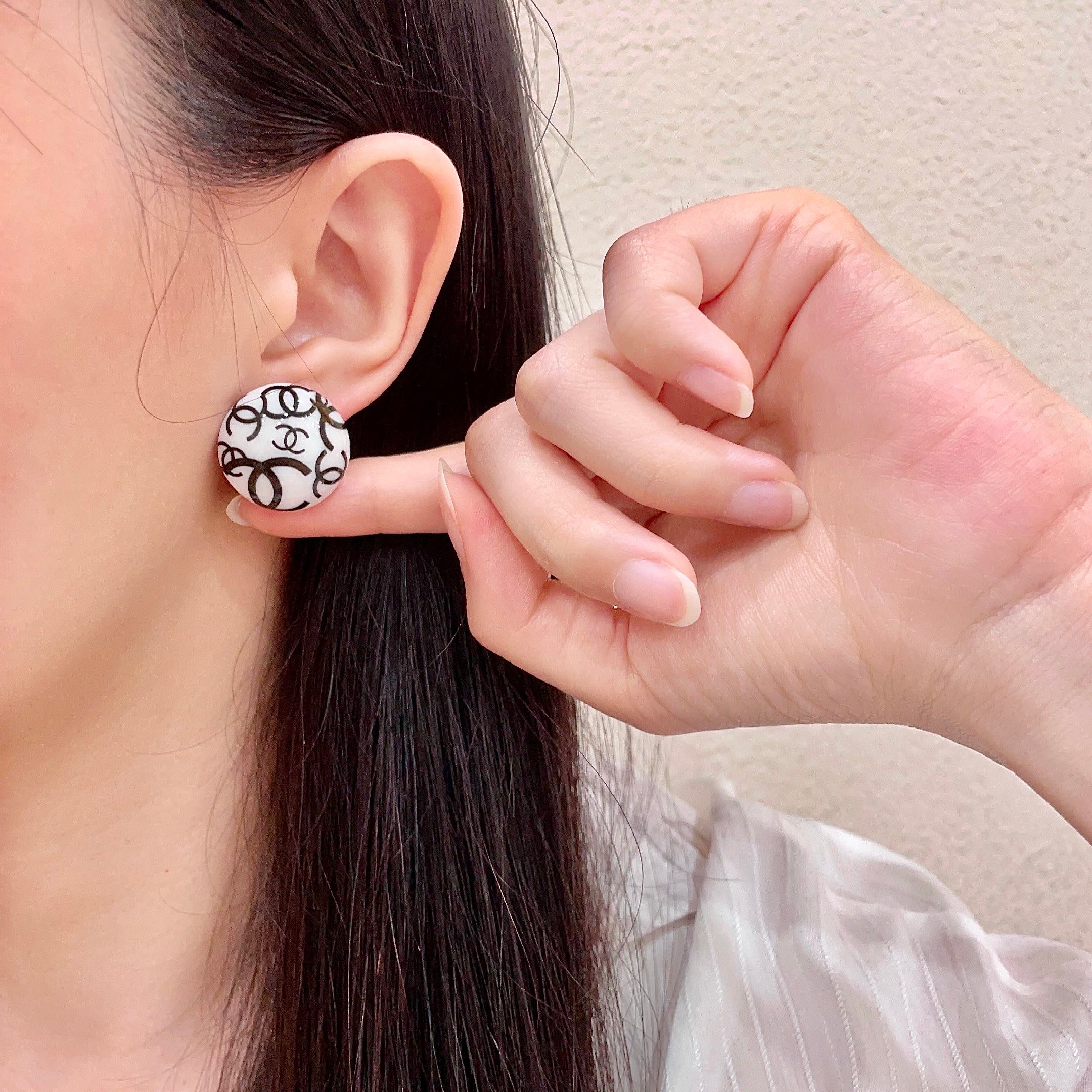 Chanel CC Logo Round Stud Earrings earrings white resin base with black interlocking CC logo detailing 2cm diameter