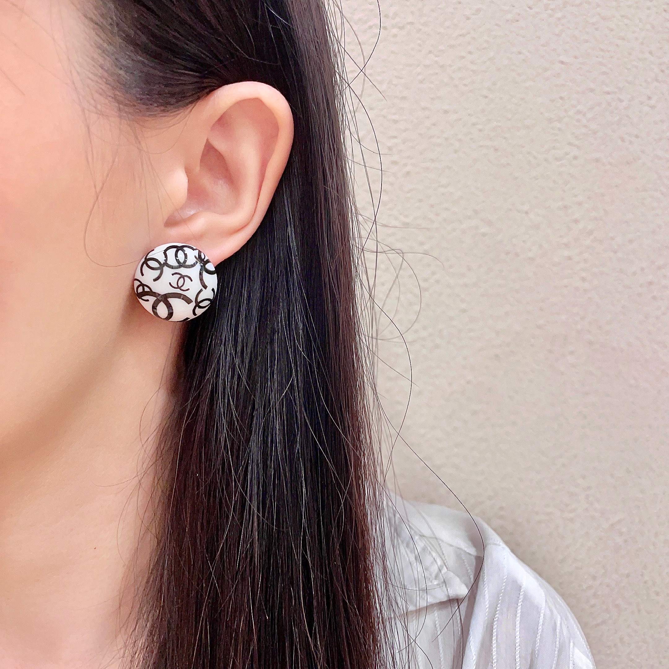 Chanel CC Logo Round Stud Earrings earrings white resin base with black interlocking CC logo detailing 2cm diameter