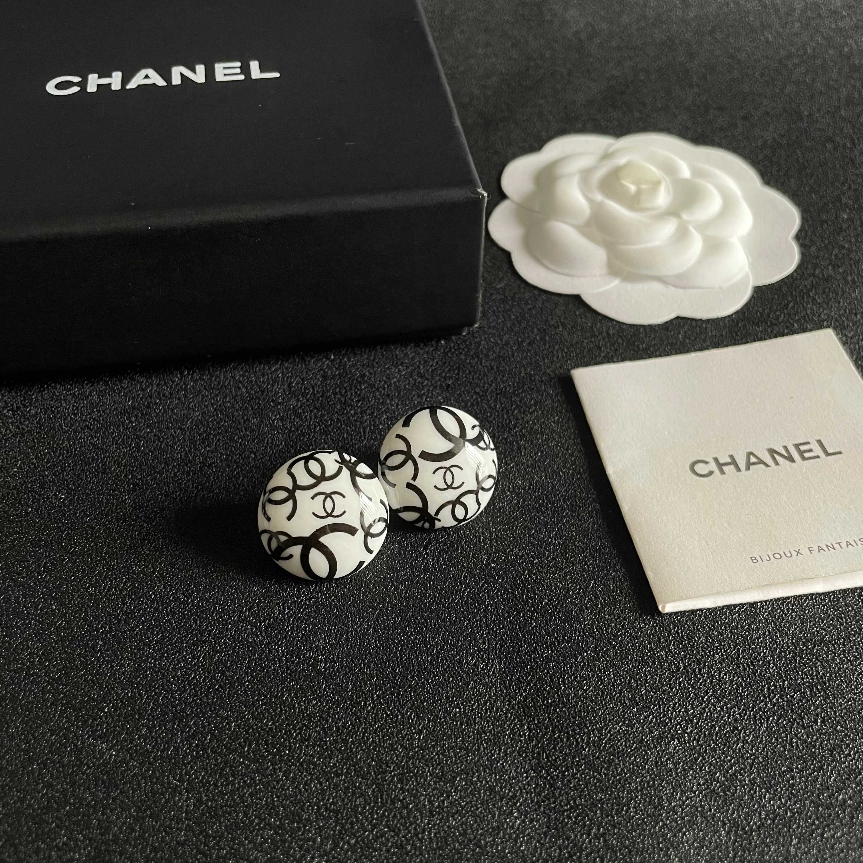 Chanel CC Logo Round Stud Earrings earrings white resin base with black interlocking CC logo detailing 2cm diameter