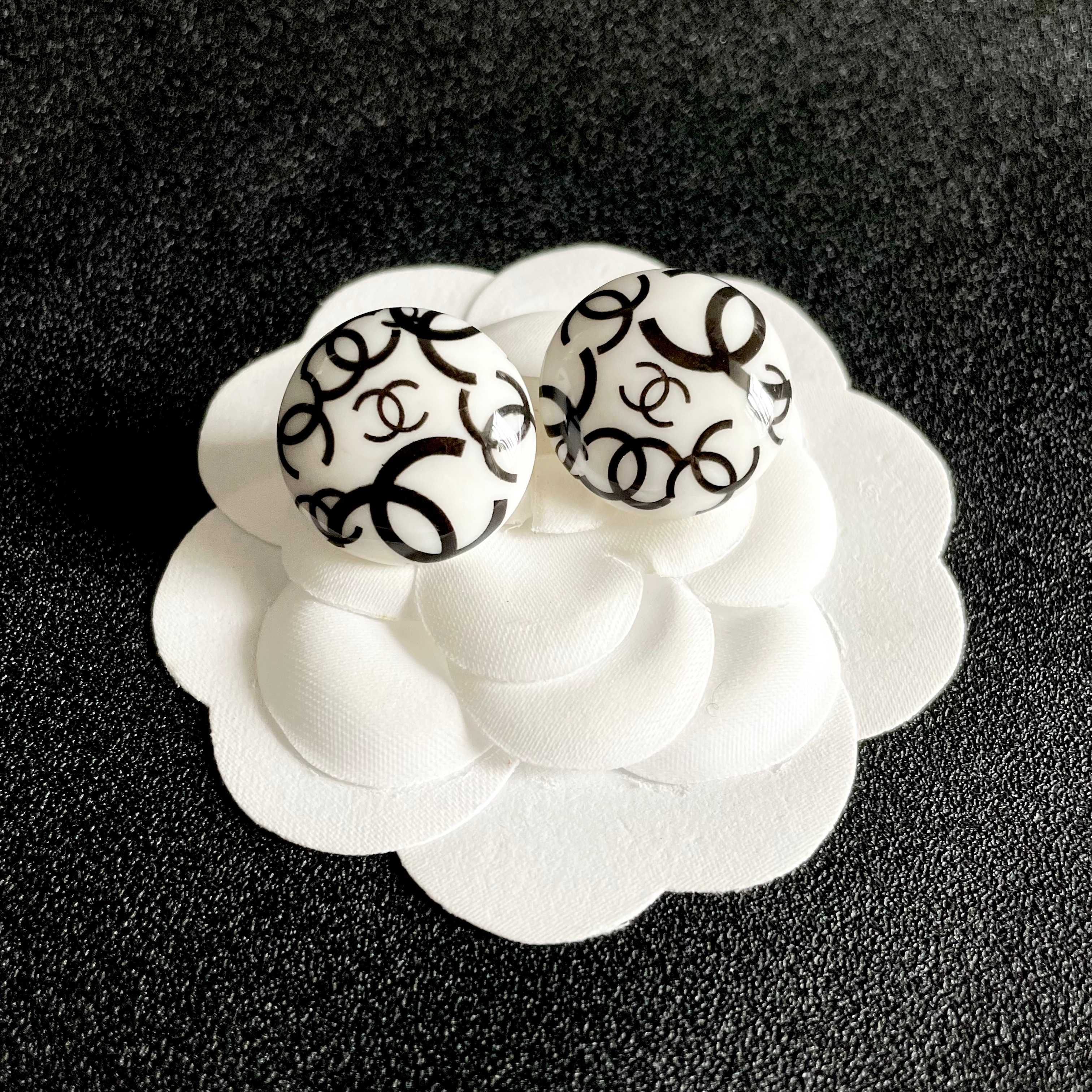 Chanel CC Logo Round Stud Earrings earrings white resin base with black interlocking CC logo detailing 2cm diameter