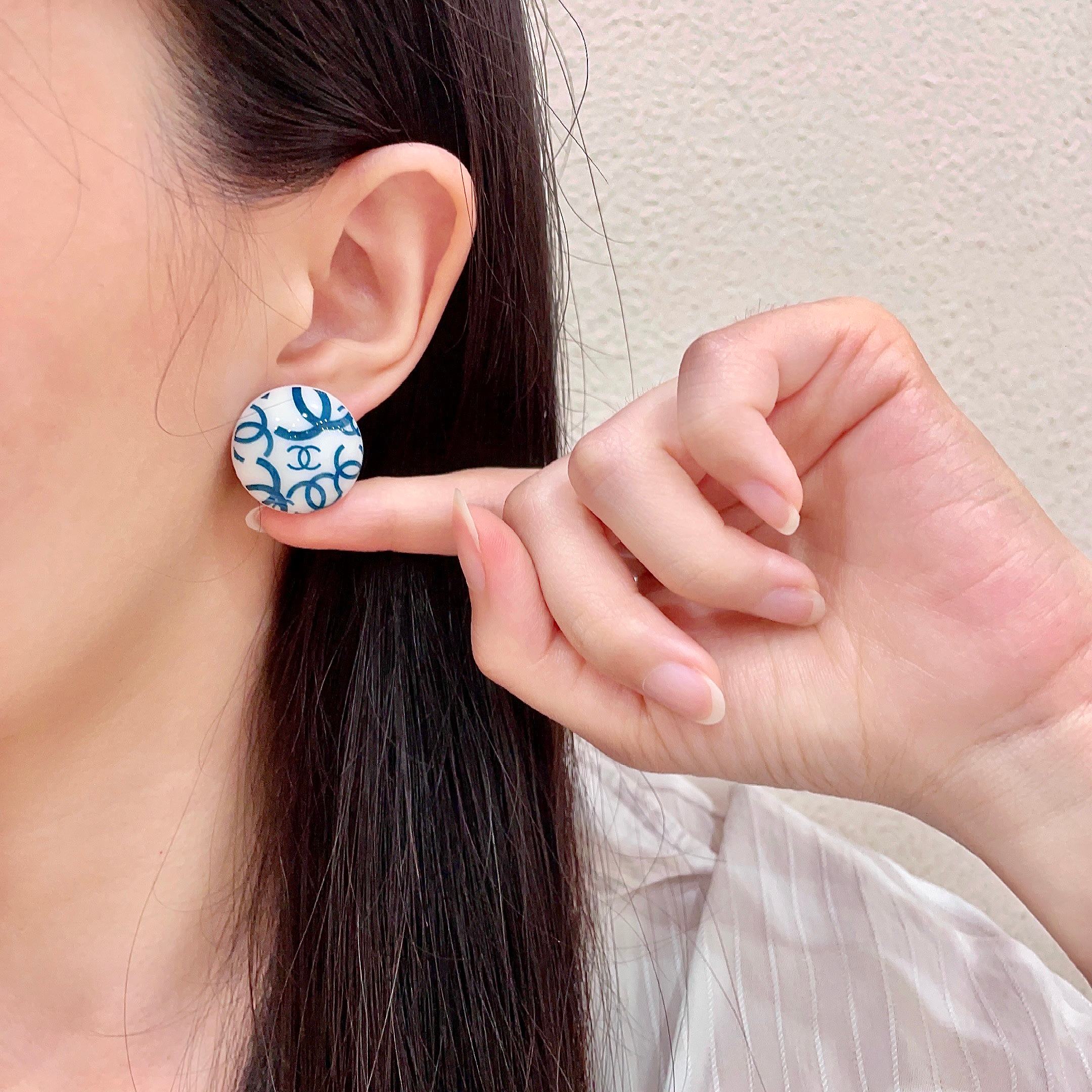 Chanel CC Logo Round Button Stud Earrings earrings White base with interlocking CC logo in black teal blue variants resin finish 2cm diameter