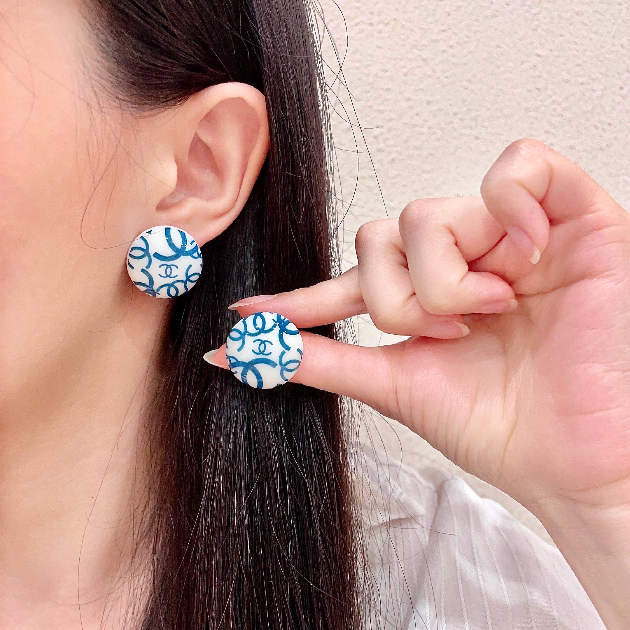 Chanel CC Logo Round Button Stud Earrings earrings White base with interlocking CC logo in black teal blue variants resin finish 2cm diameter