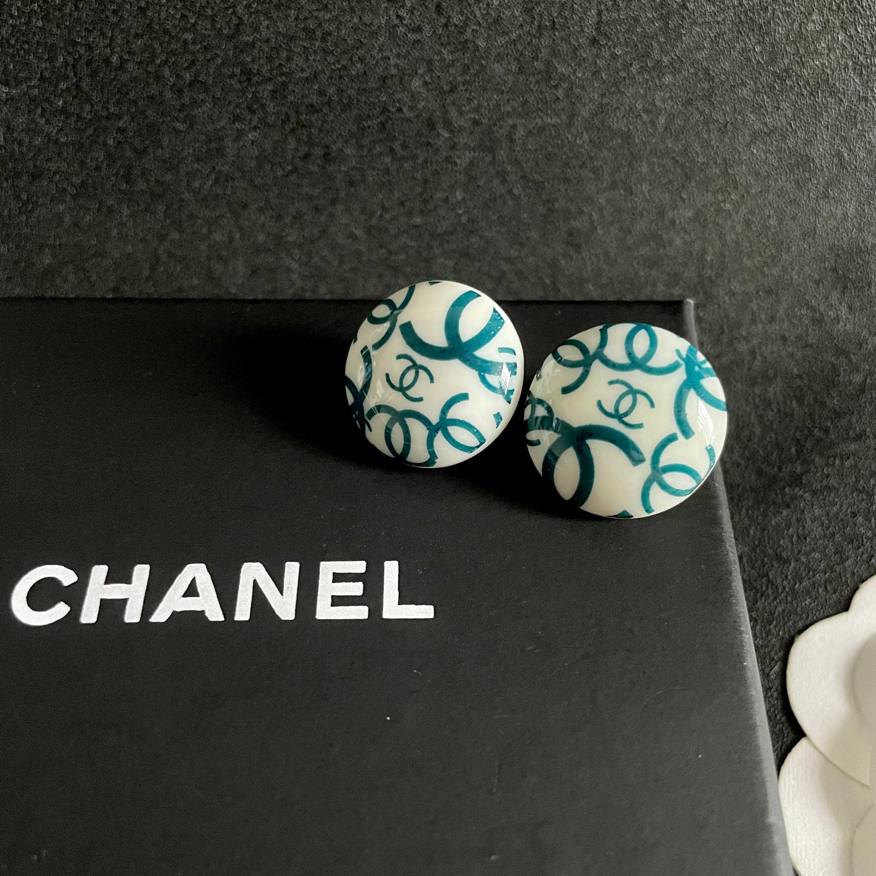 Chanel CC Logo Round Button Stud Earrings earrings White base with interlocking CC logo in black teal blue variants resin finish 2cm diameter