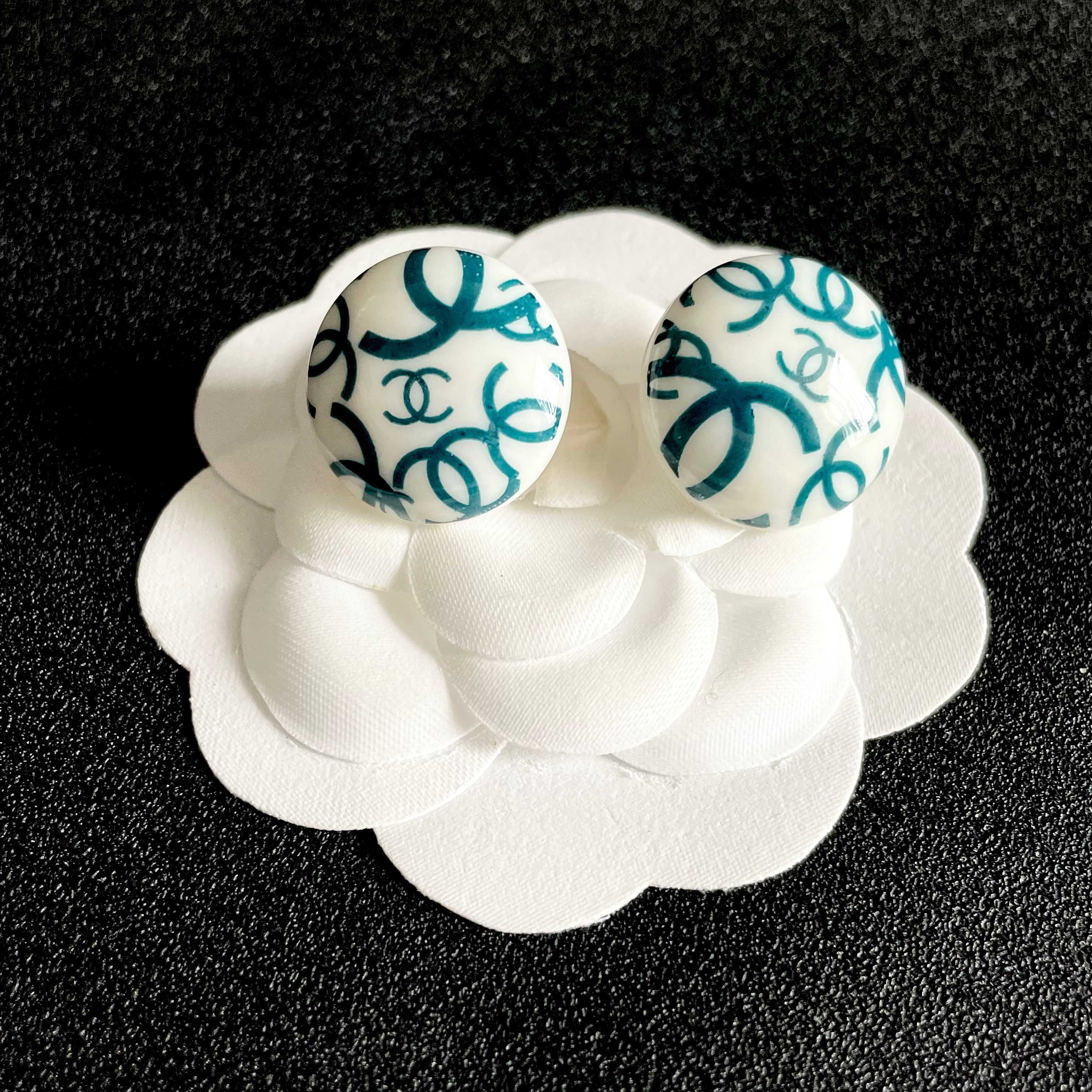 Chanel CC Logo Round Button Stud Earrings earrings White base with interlocking CC logo in black teal blue variants resin finish 2cm diameter
