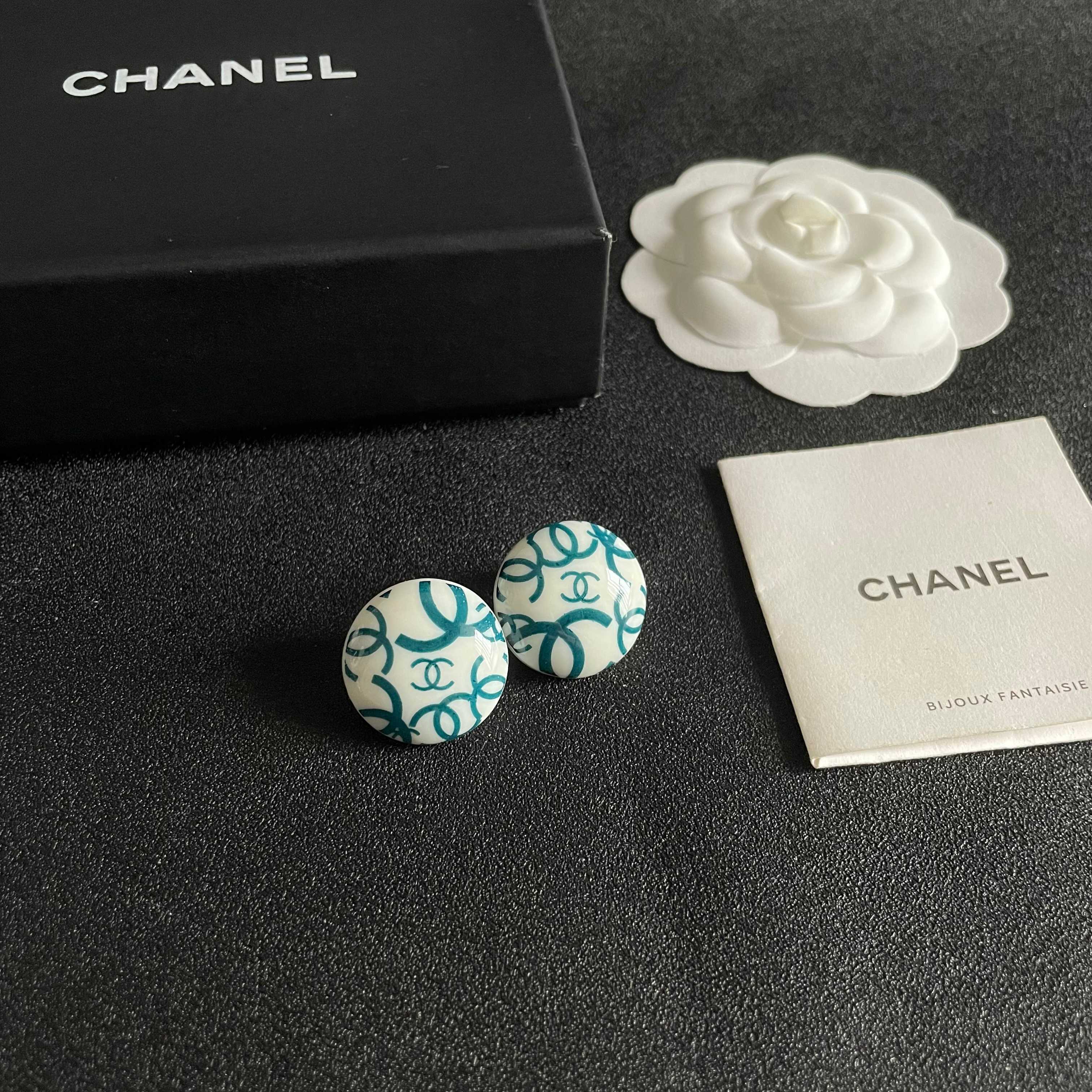 Chanel CC Logo Round Button Stud Earrings earrings White base with interlocking CC logo in black teal blue variants resin finish 2cm diameter
