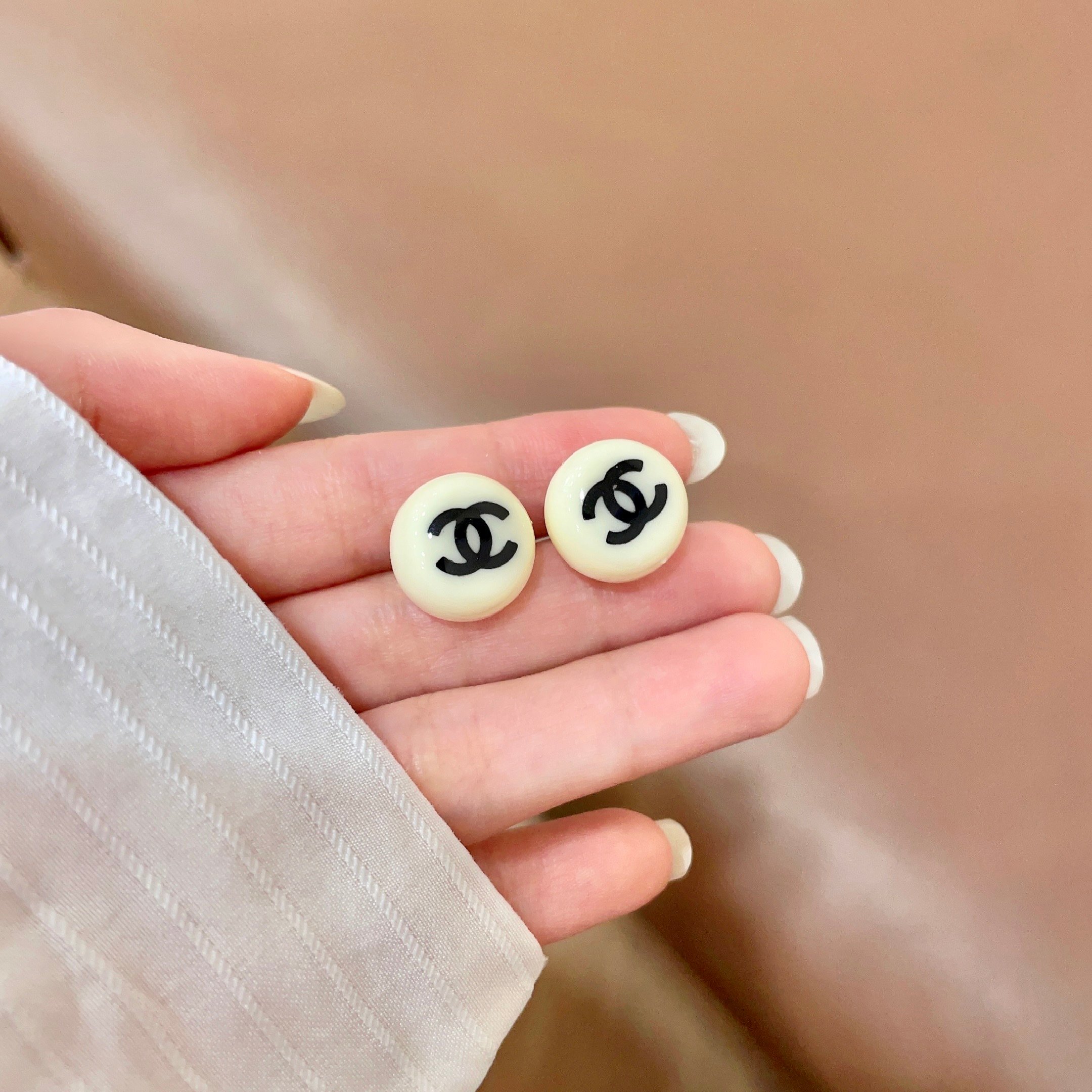 Chanel CC Logo Round Stud Earrings earrings Cream ivory resin with black interlocking CC logo 1 2cm diameter