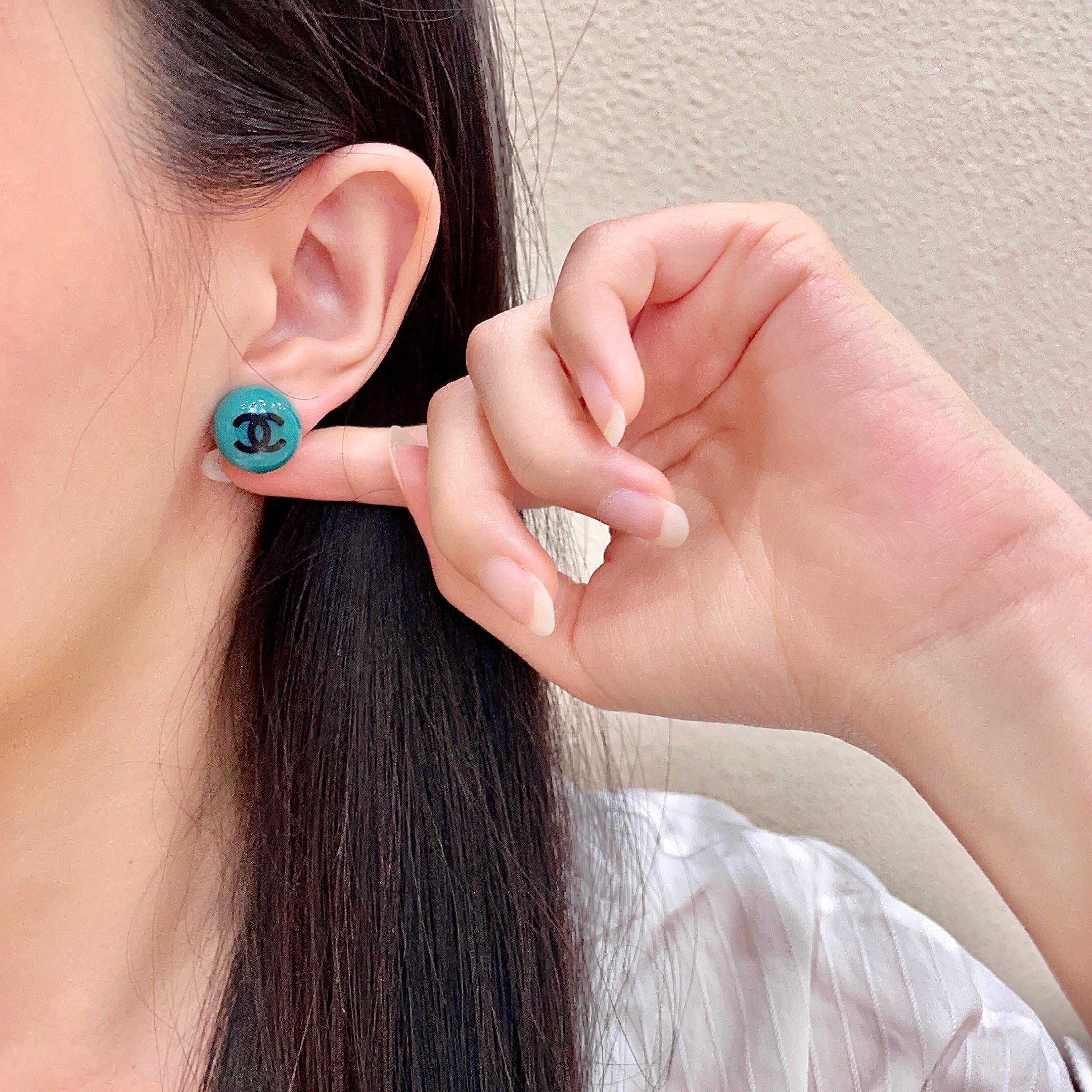 Chanel CC Logo Round Stud Earrings earrings Turquoise resin with black interlocking CC logo silver-toned metal hardware 1 2cm diameter