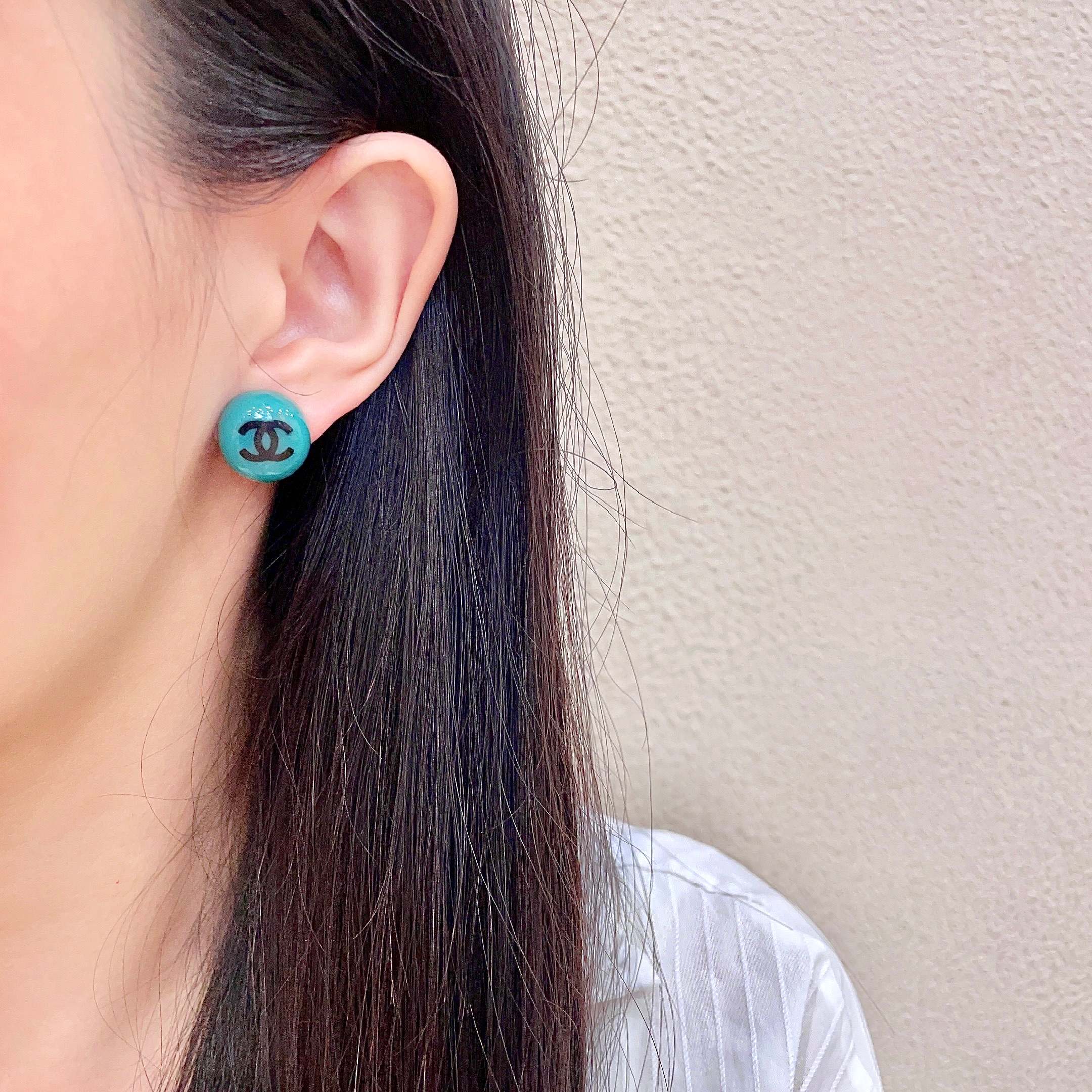 Chanel CC Logo Round Stud Earrings earrings Turquoise resin with black interlocking CC logo silver-toned metal hardware 1 2cm diameter