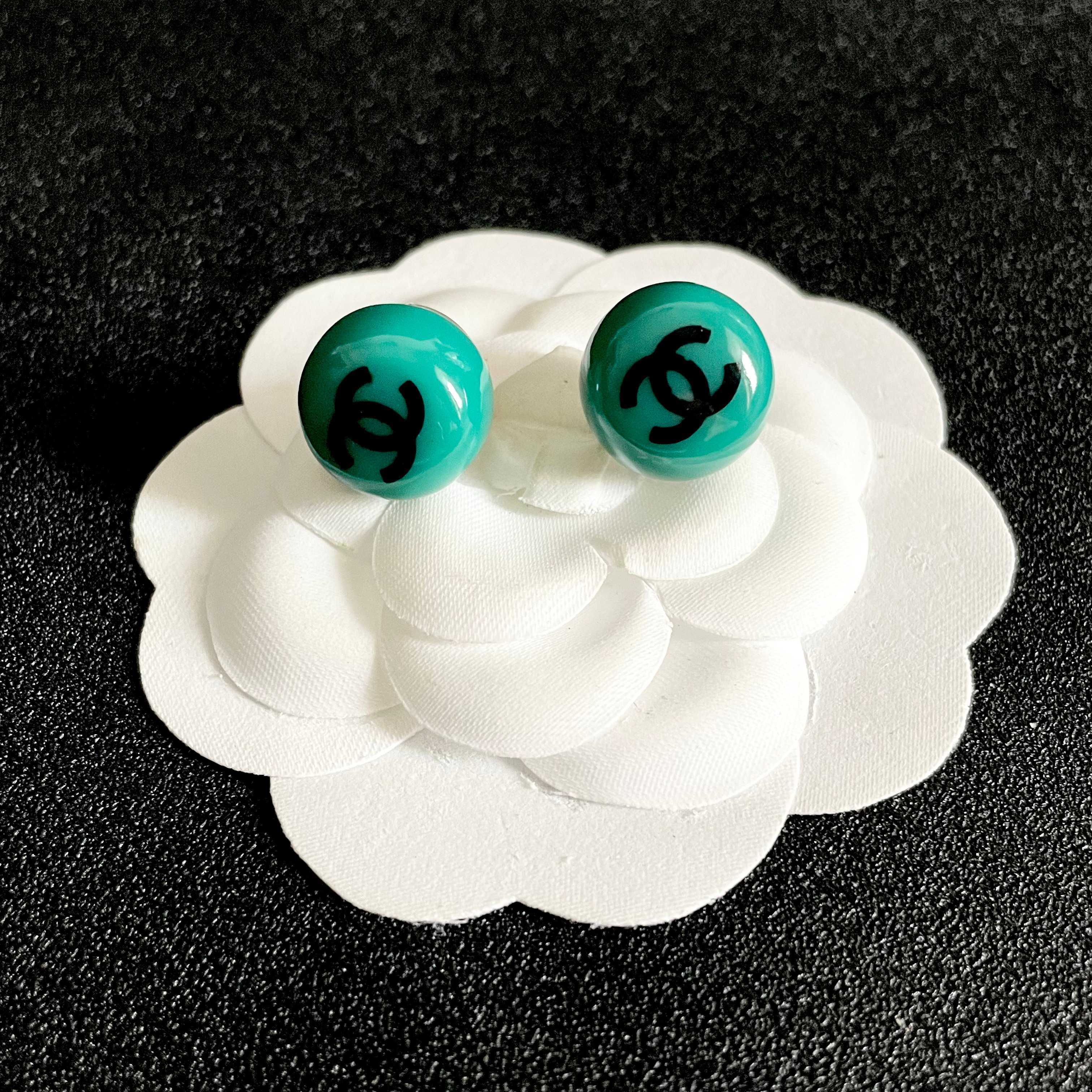 Chanel CC Logo Round Stud Earrings earrings Turquoise resin with black interlocking CC logo silver-toned metal hardware 1 2cm diameter