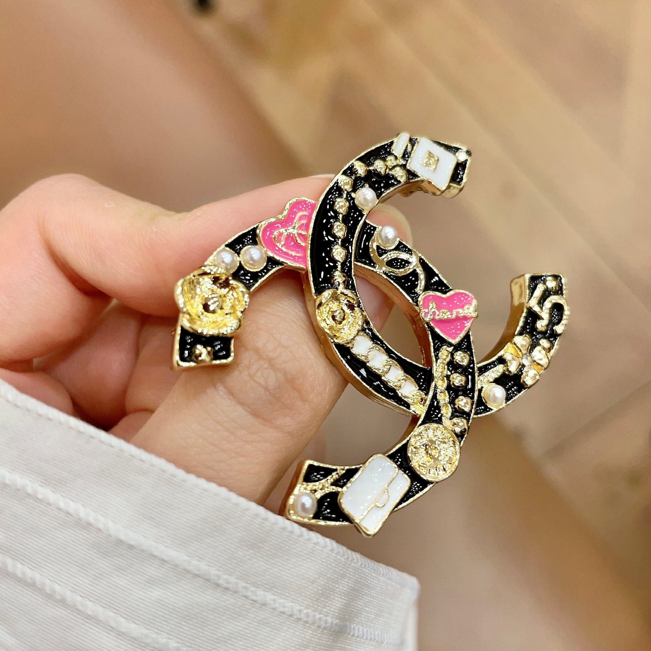Chanel CC Logo Heart Charms Brooch brooch gold tone metal with black enamel pink enamel hearts white enamel bag charms white faux pearls 3 5cm width