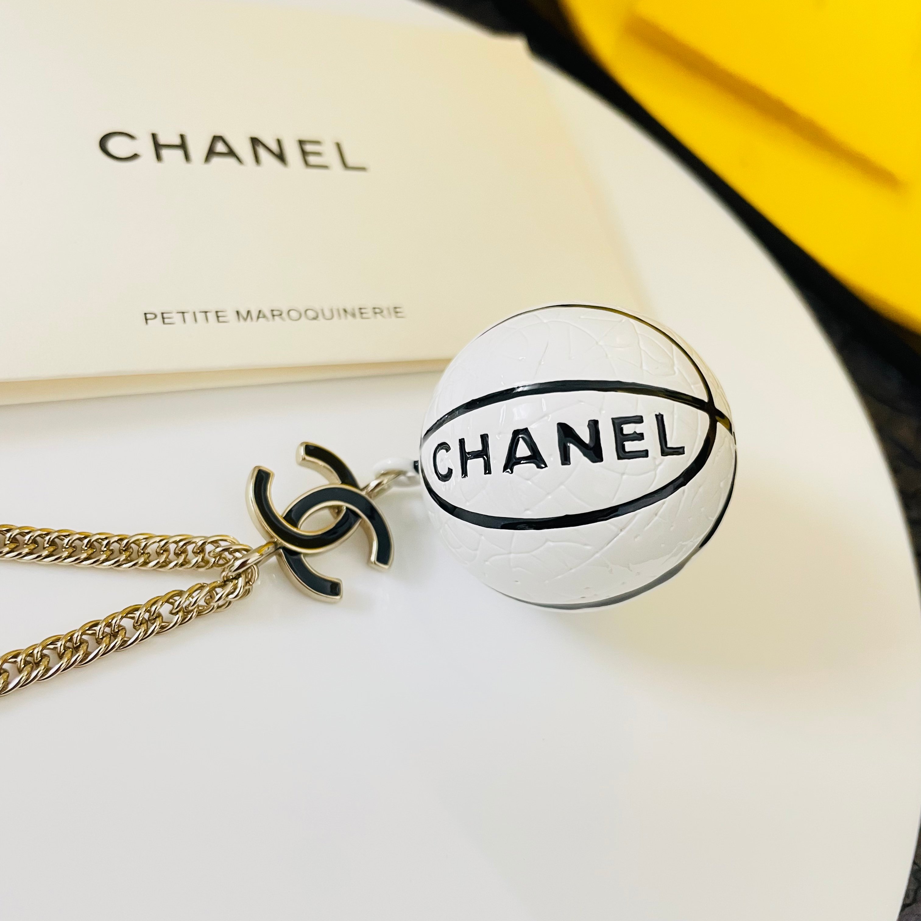 Chanel CC Basketball Pendant Necklace necklace Gold-tone metal white enamel with black line detailing black enamel CC logo 60cm with 7cm extender chain