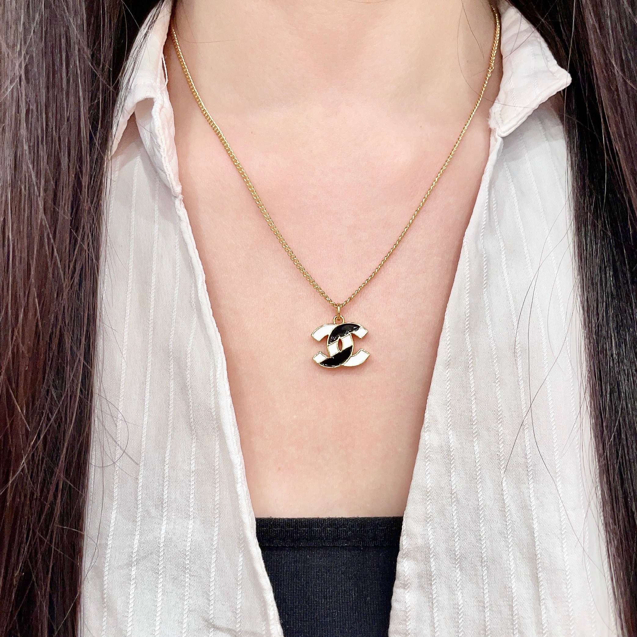 Chanel CC Logo Enamel Pendant necklace gold-tone metal with black and white enamel 42cm