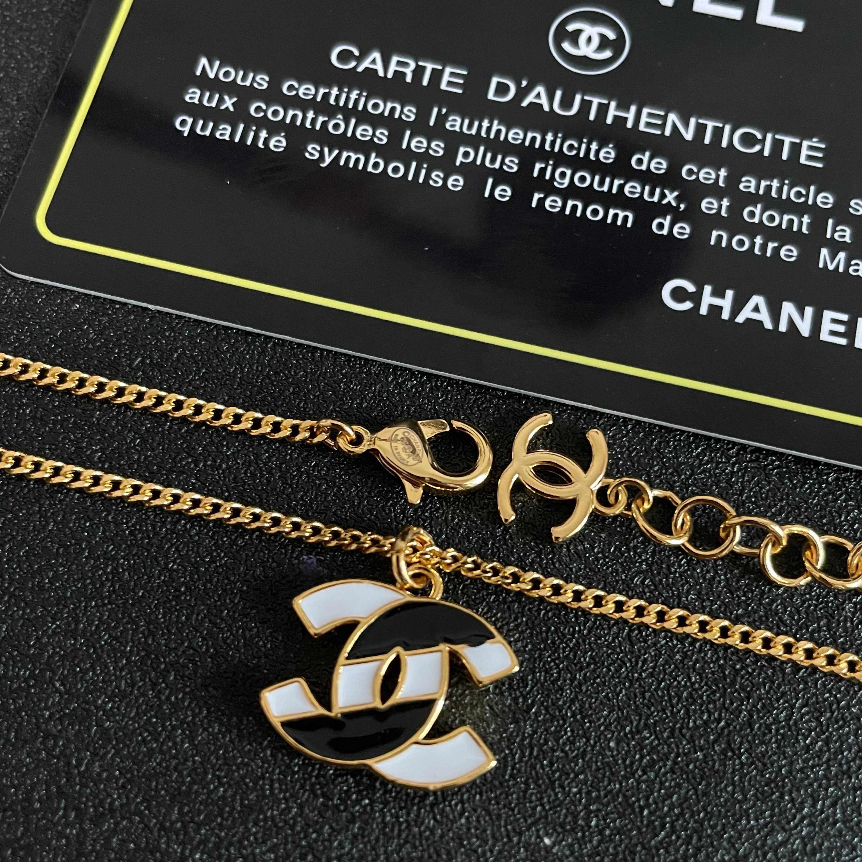 Chanel CC Logo Enamel Pendant necklace gold-tone metal with black and white enamel 42cm