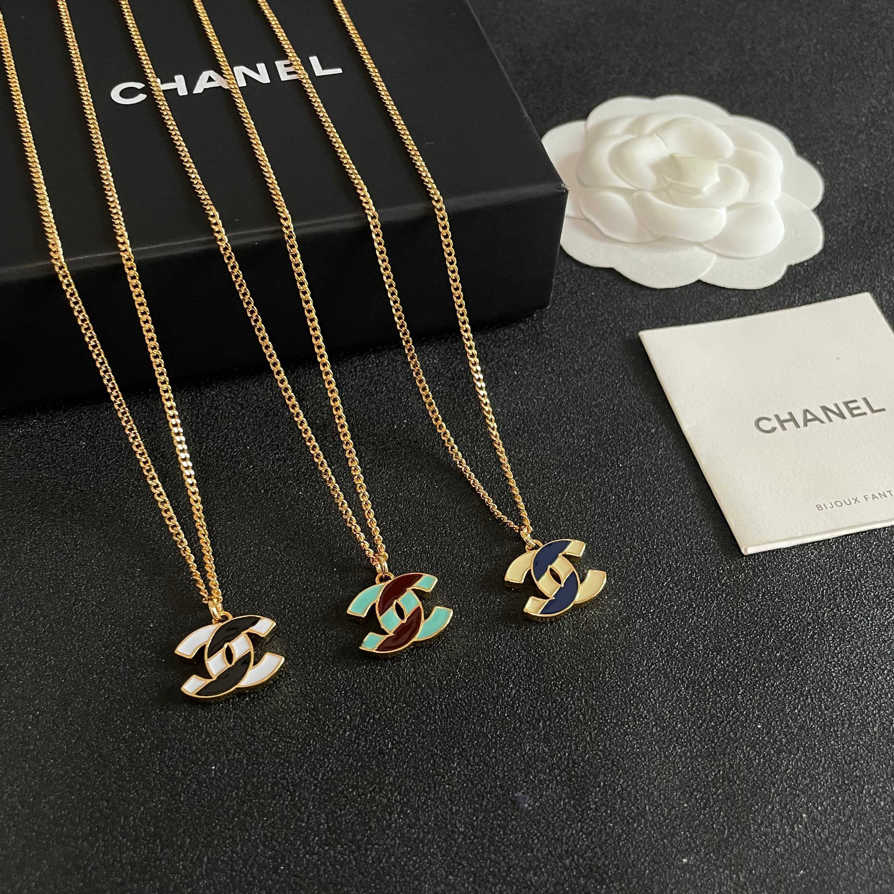 Chanel CC Enamel Pendant necklace Gold-tone metal with cream and navy blue enamel 42cm
