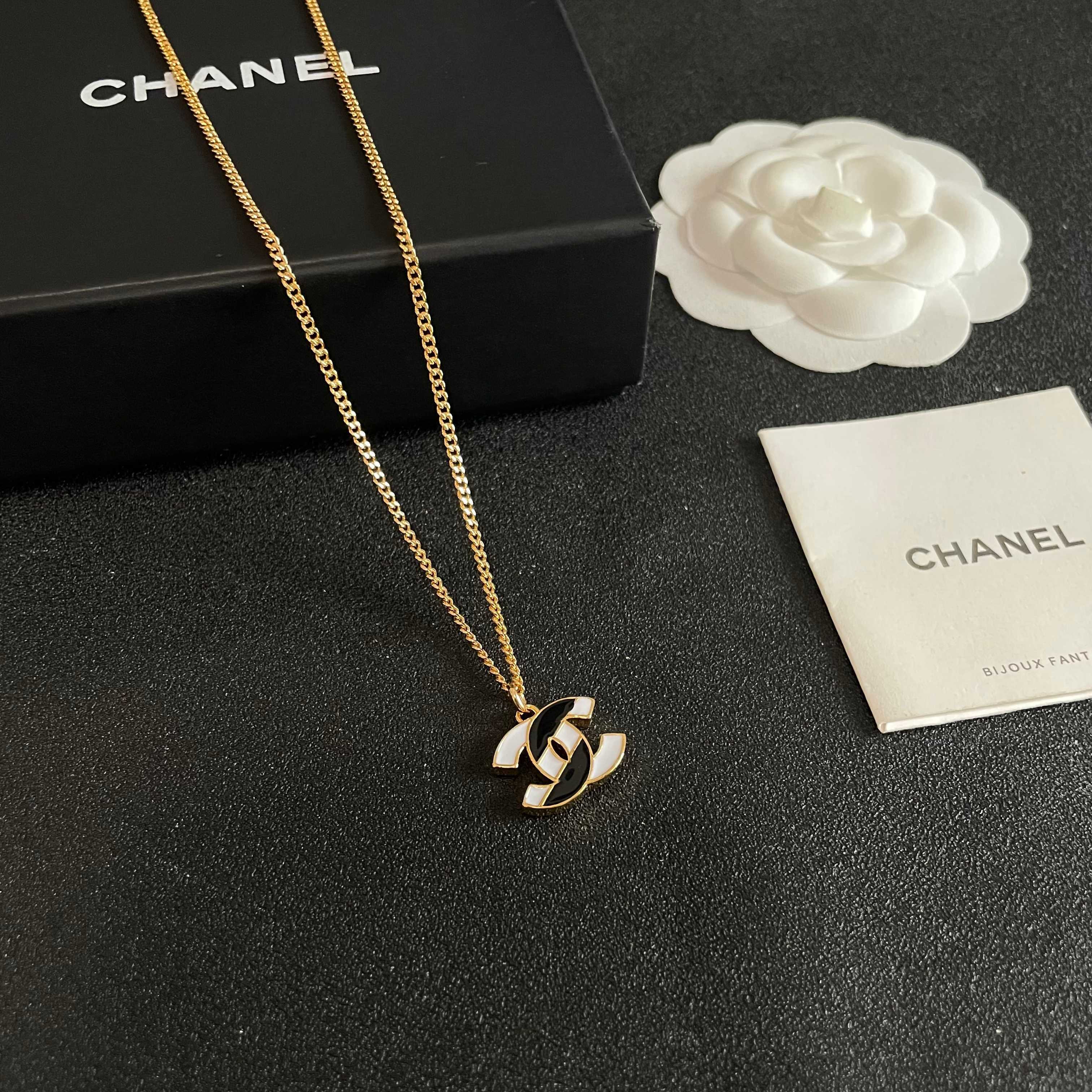 Chanel CC Logo Enamel Pendant necklace gold-tone metal with black and white enamel 42cm