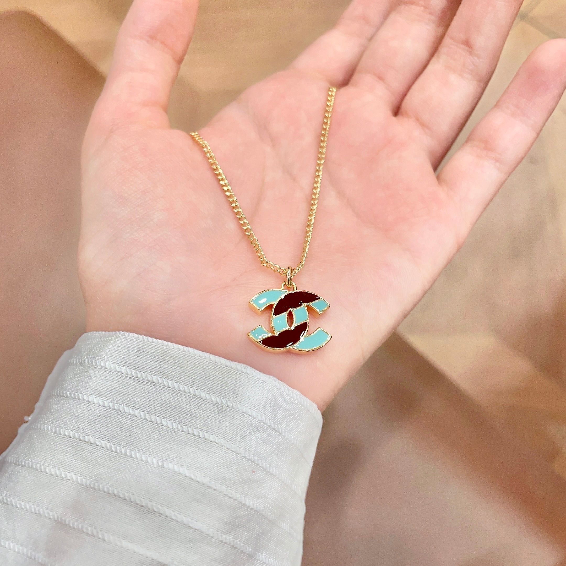 Chanel CC Logo Enamel necklace gold-tone metal with turquoise and burgundy enamel 42cm