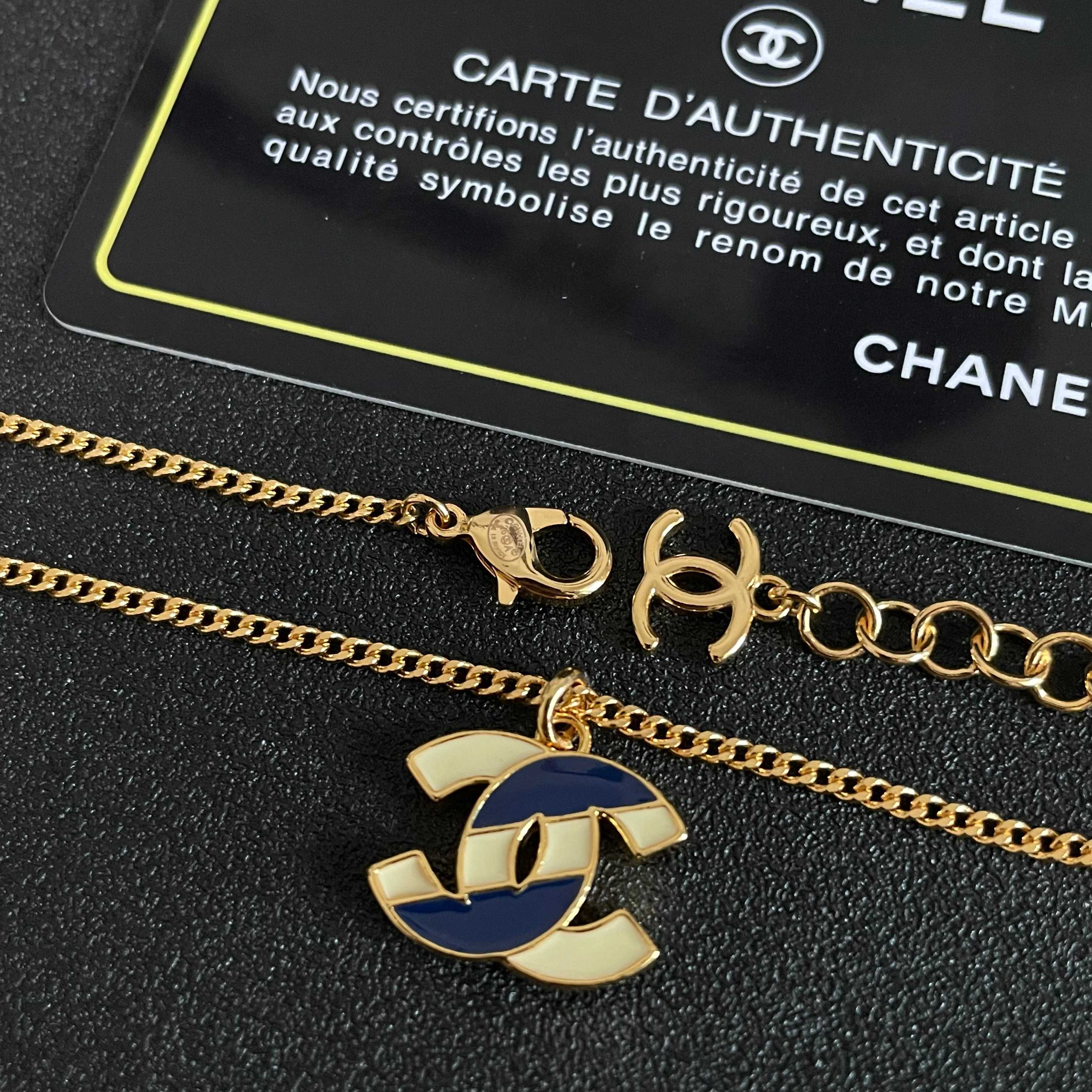Chanel CC Enamel Pendant necklace Gold-tone metal with cream and navy blue enamel 42cm