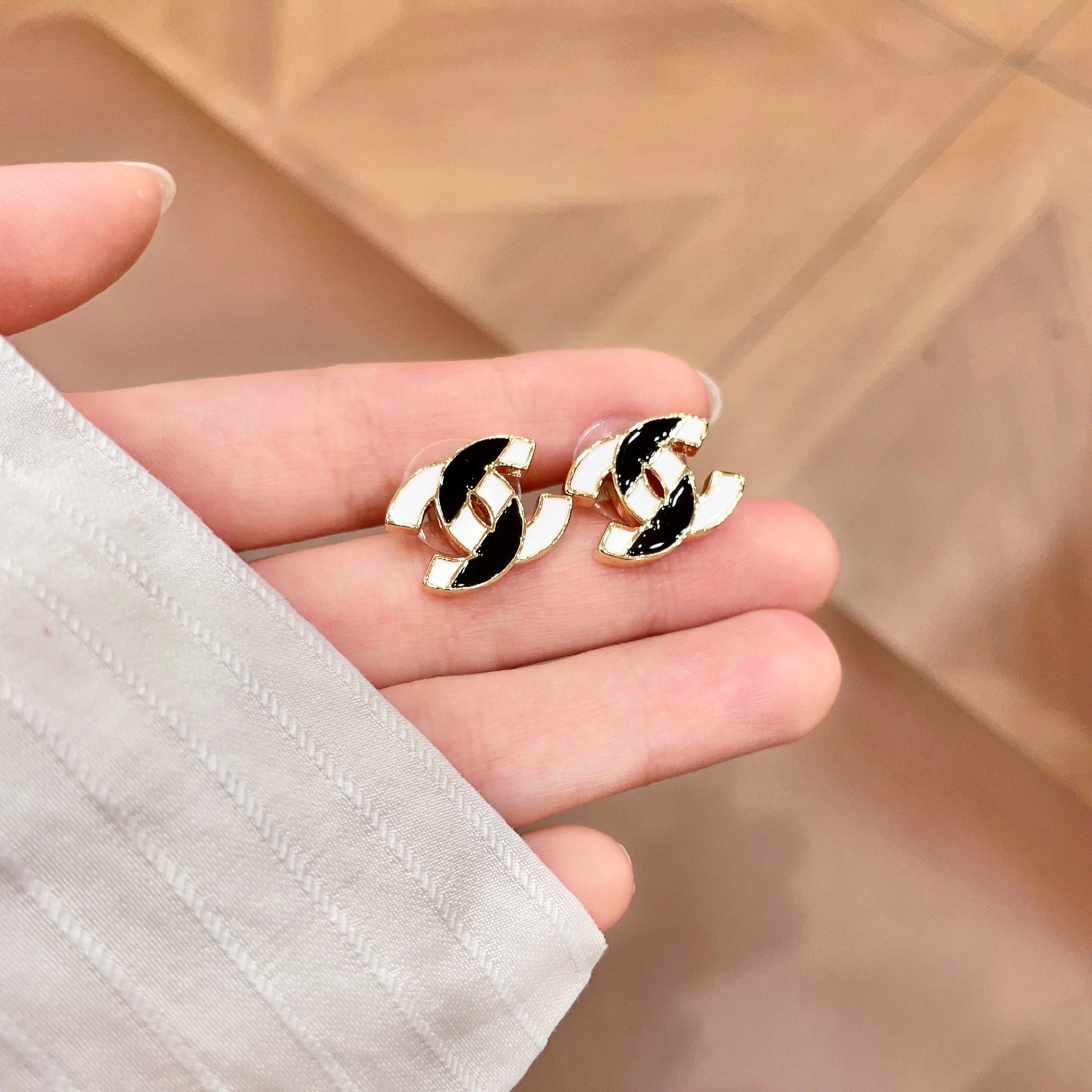 Chanel CC Logo Enamel Stud Earrings earrings Gold-tone metal with black and white enamel 1 5cm stud diameter
