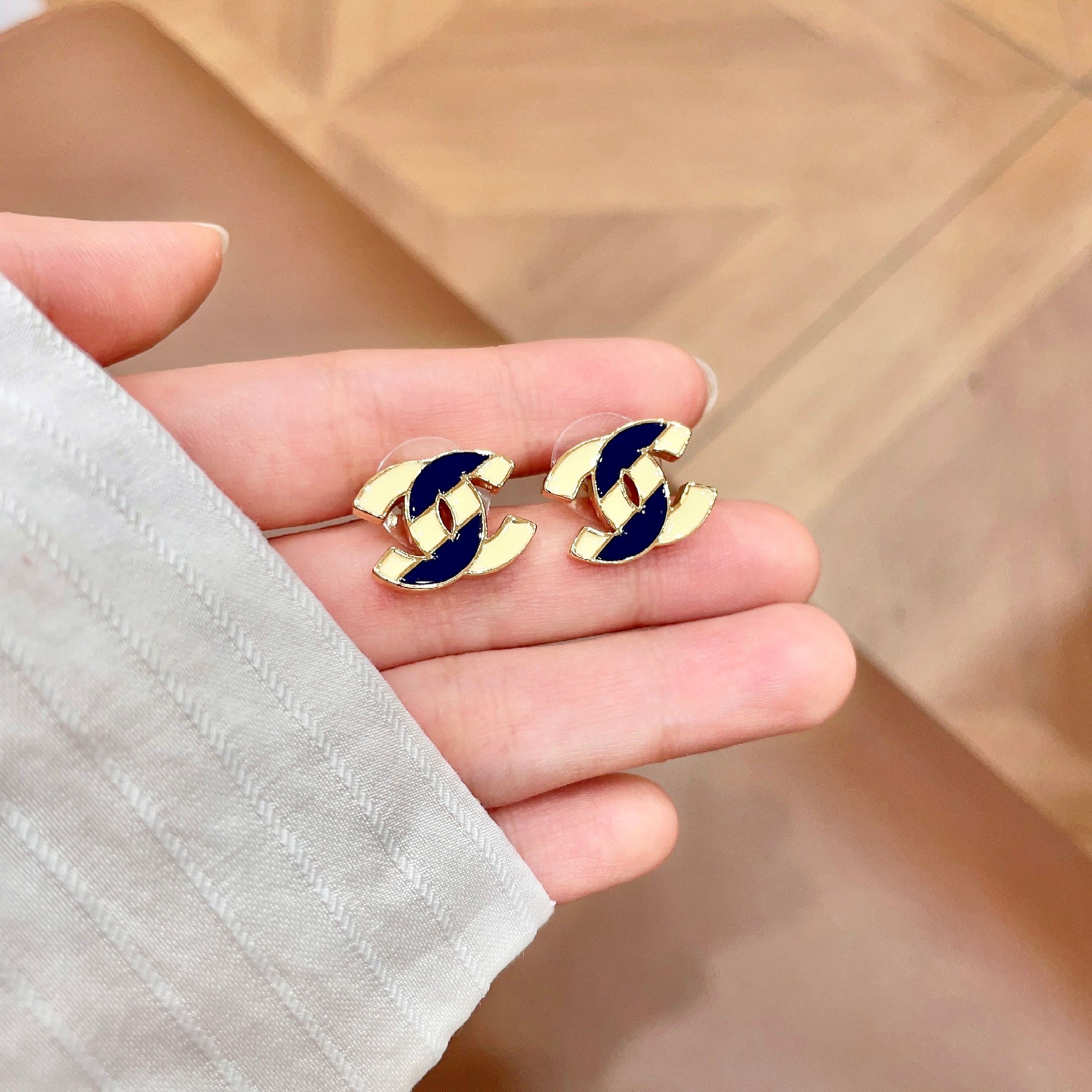 Chanel CC Logo Stud Earrings earrings gold-tone metal with cream and navy blue enamel 1 5cm stud diameter