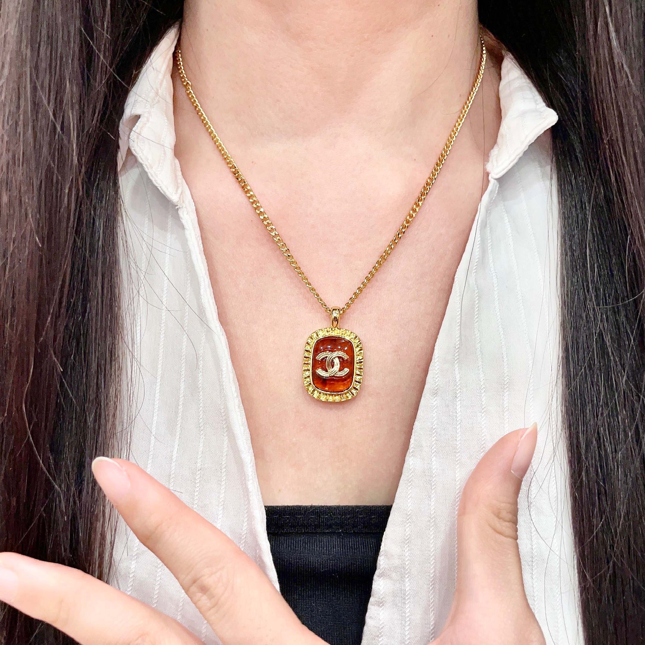 Chanel CC Logo Amber Resin Pendant necklace Gold-tone metal with amber orange resin 45cm