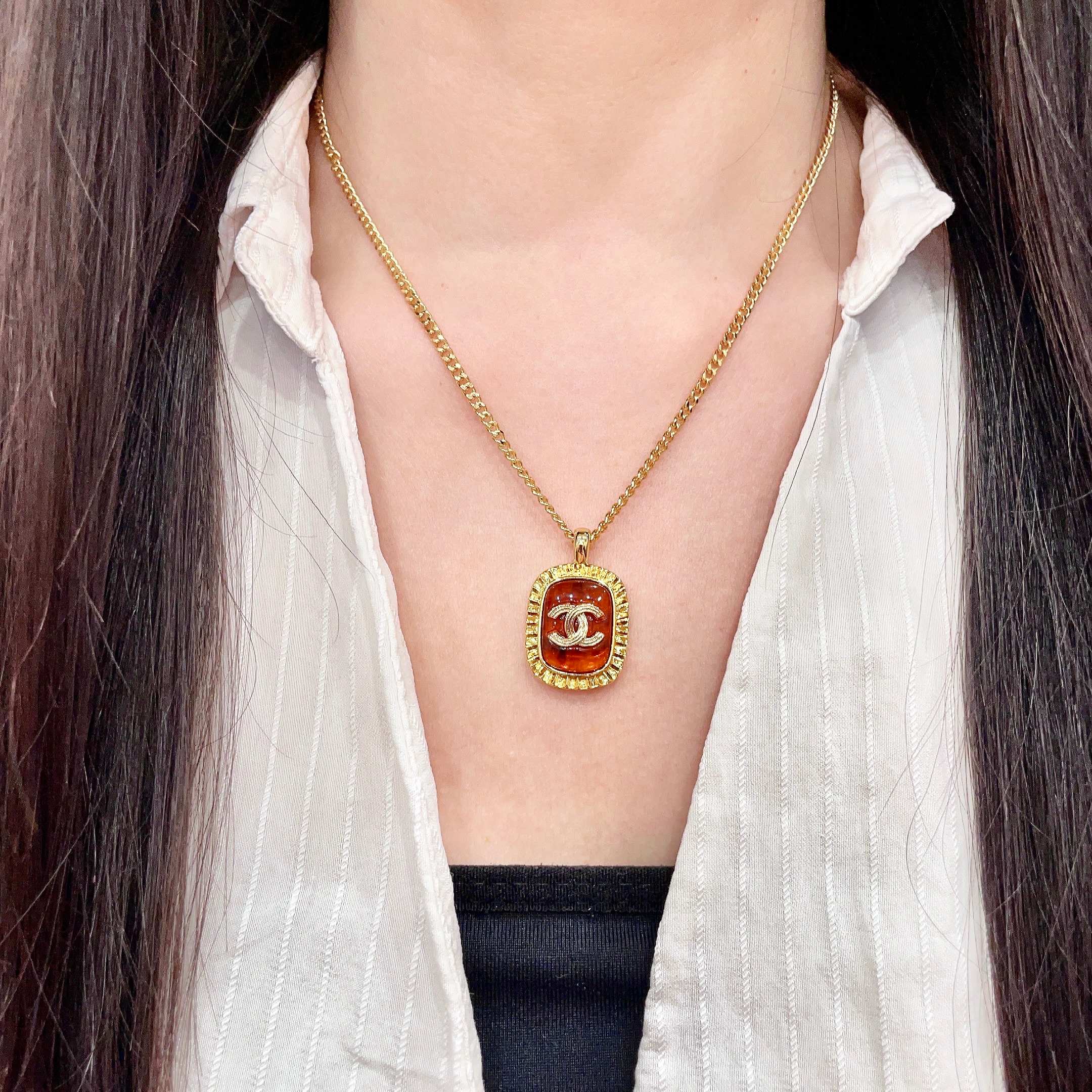 Chanel CC Logo Amber Resin Pendant necklace Gold-tone metal with amber orange resin 45cm