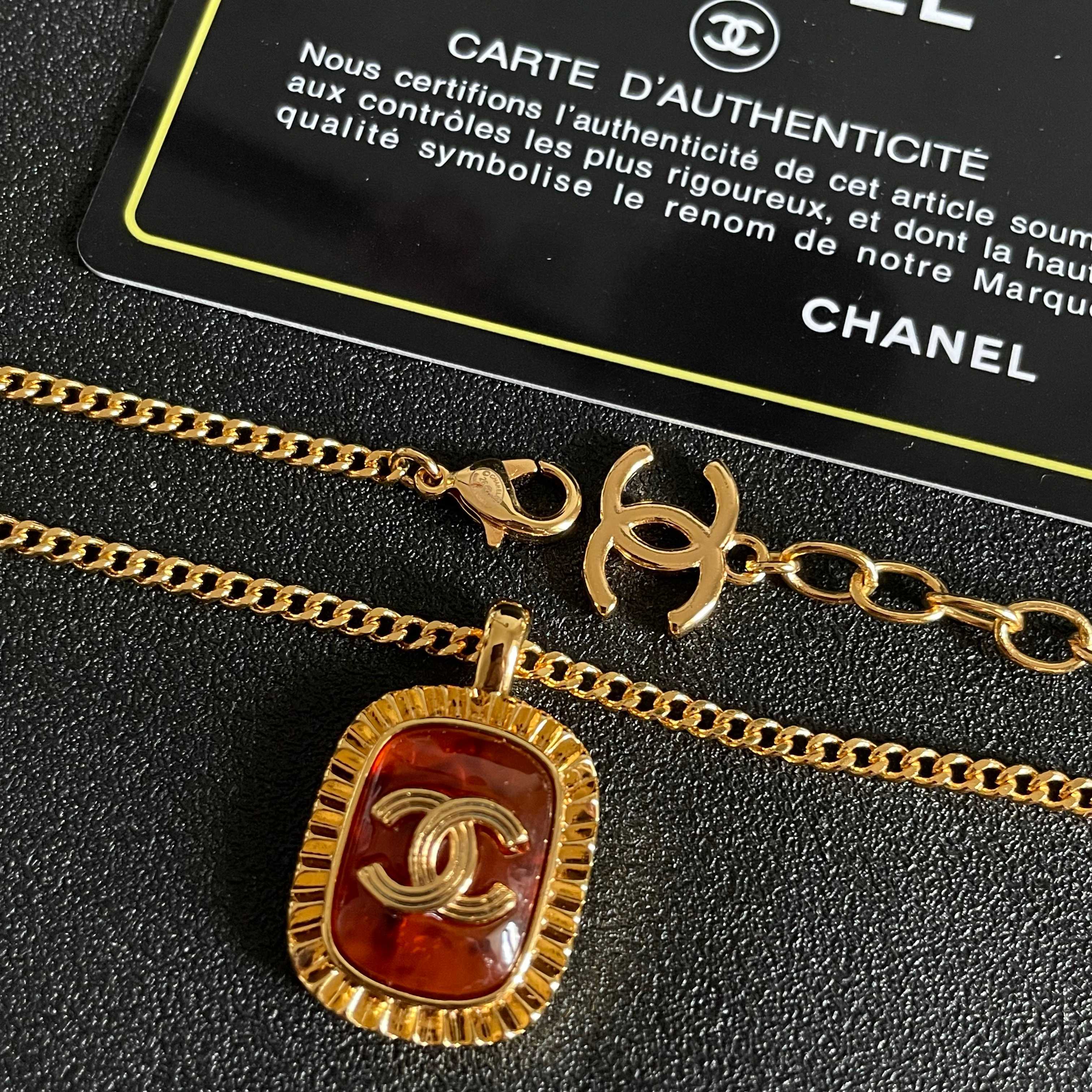 Chanel CC Logo Amber Resin Pendant necklace Gold-tone metal with amber orange resin 45cm